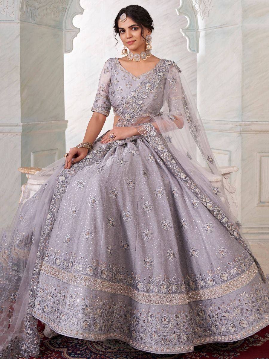 Elegant grey designer lehenga choli with intricate embroidery and sheer dupatta for Indian ethnic wear