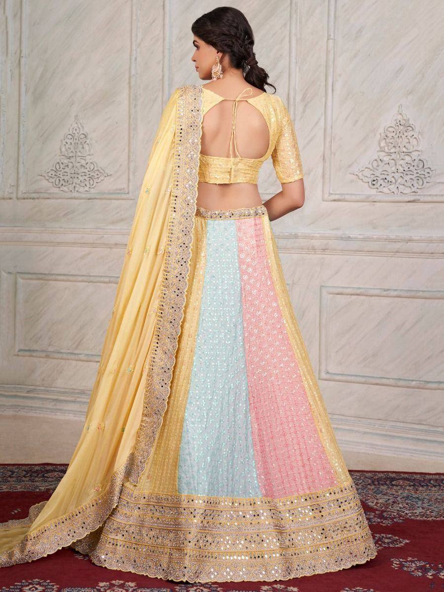 Pastel color-block lehenga choli with gold embroidery, backless blouse, and dupatta for Indian ethnic wear