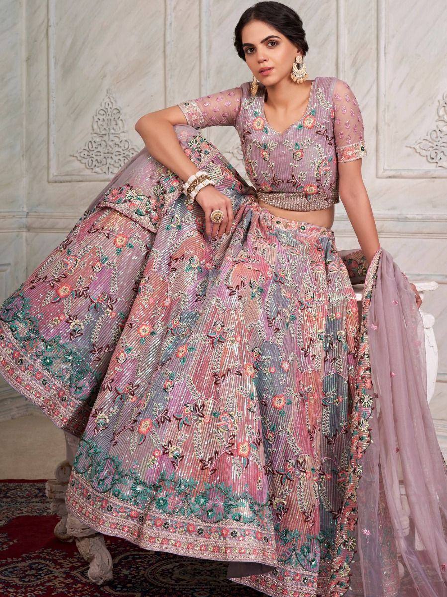 Elegant floral embroidered lehenga choli with sheer sleeves and dupatta, perfect for Indian weddings or festive occasions.