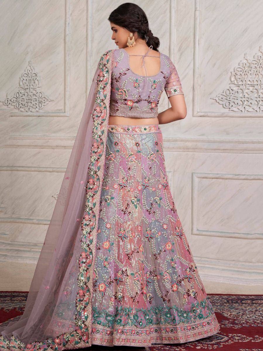 Elegant lavender lehenga choli with floral embroidery and sheer dupatta, perfect for Indian ethnic occasions.