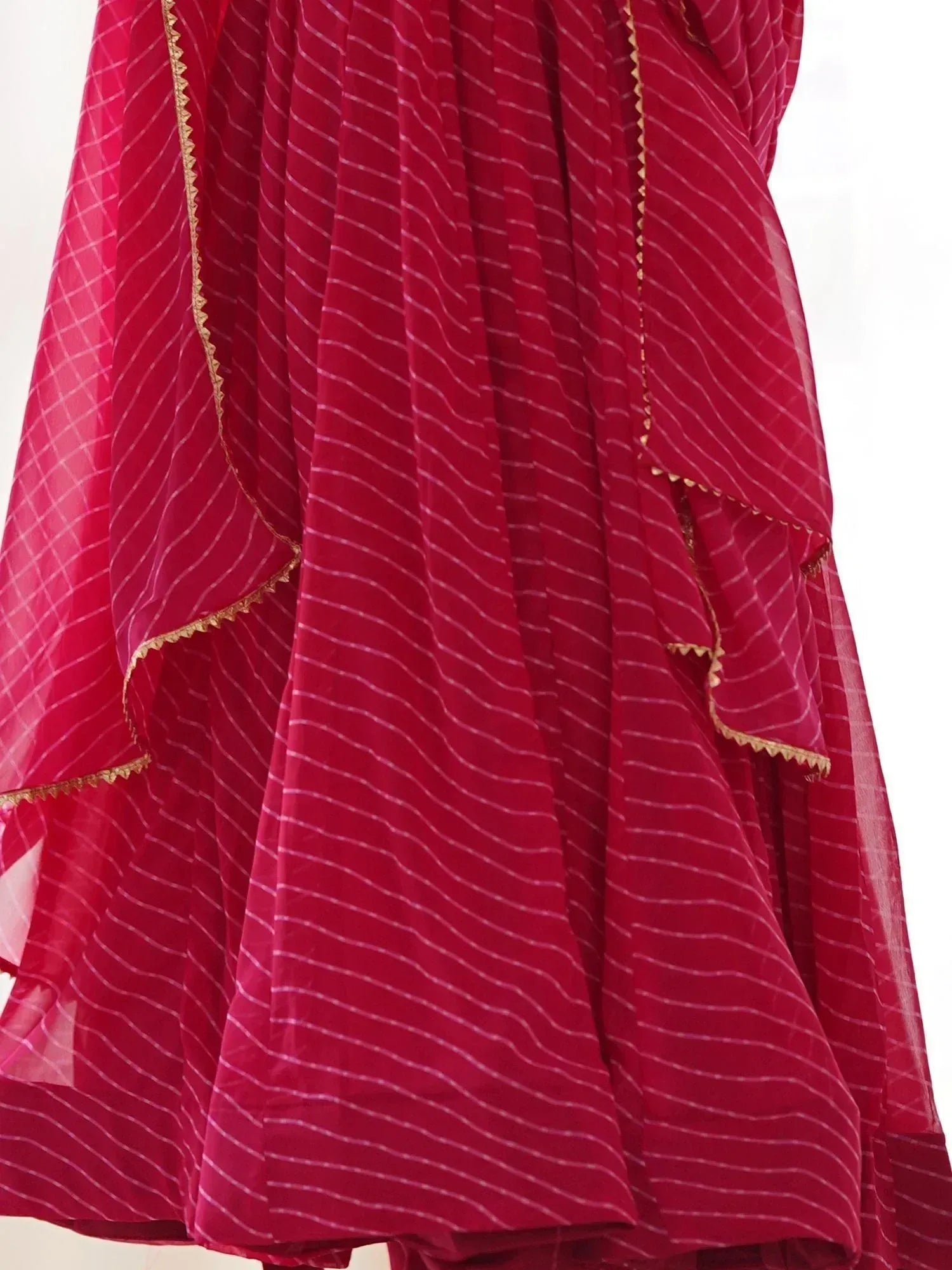 Red striped ethnic gown with gold trim, ideal for Indian occasions and festive wear