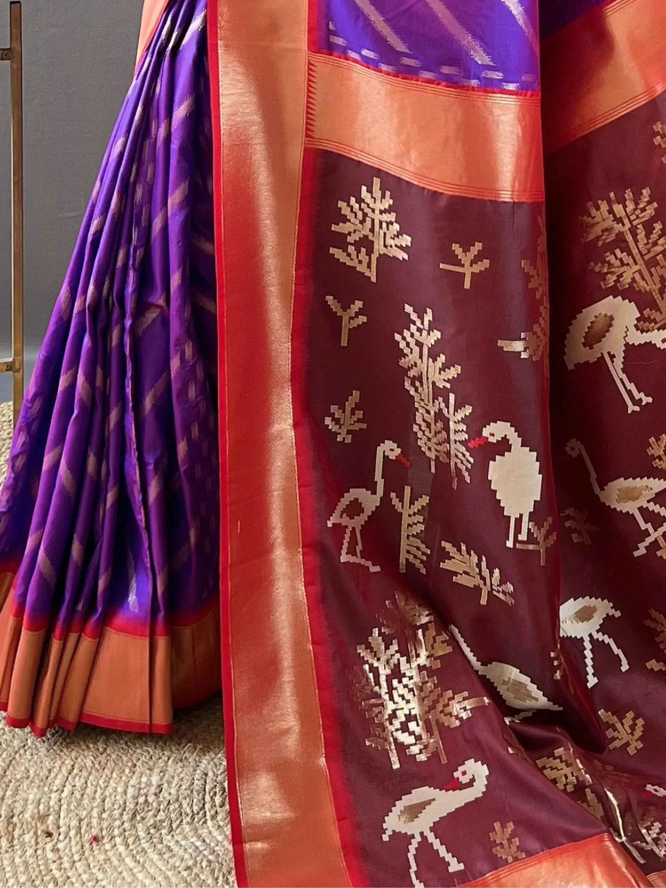 Purple and maroon silk saree with woven bird and tree motifs, gold border, ethnic Indian wear