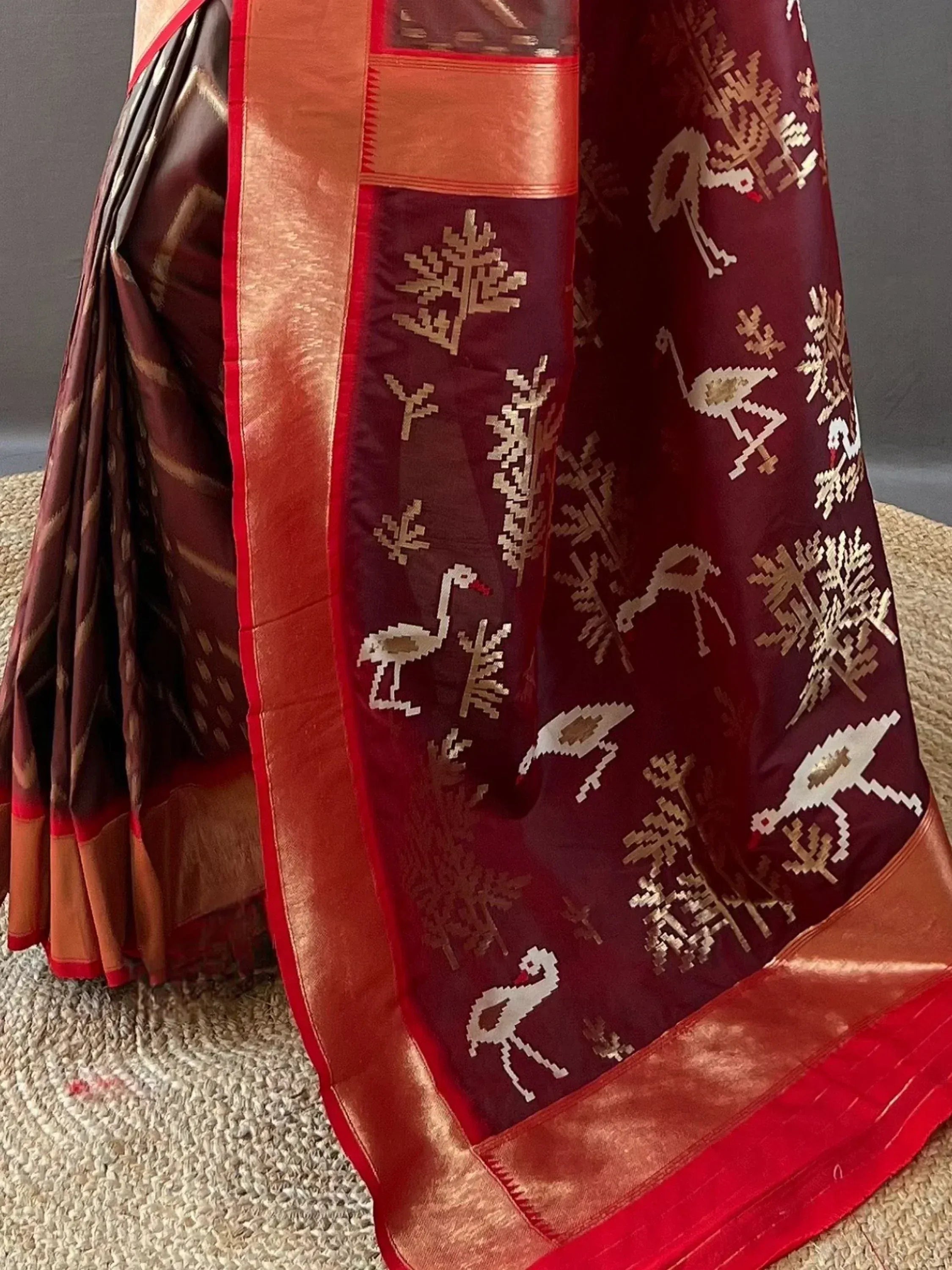 Maroon silk saree with golden bird and tree motifs, red border, ethnic Indian wear