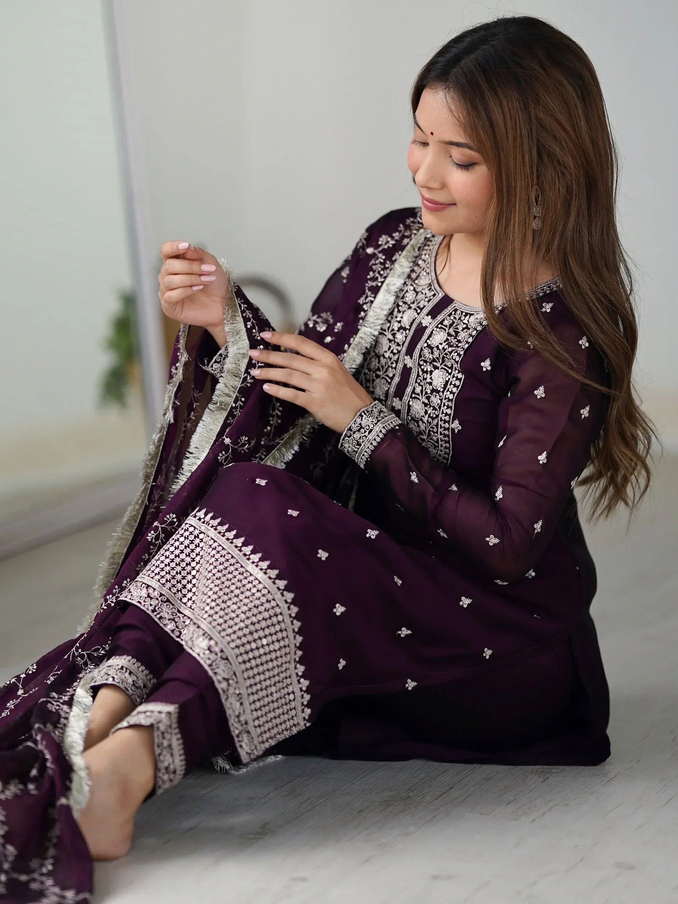 Elegant purple embroidered salwar kameez with intricate white detailing, perfect for ethnic wear.