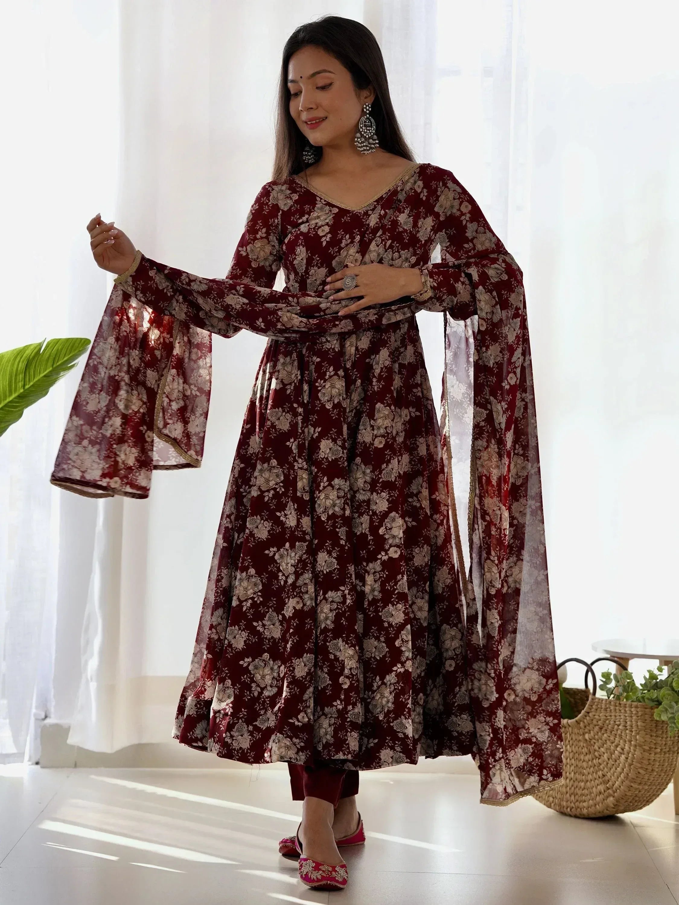 Maroon floral ethnic gown with bell sleeves, perfect for Indian occasions and festive wear