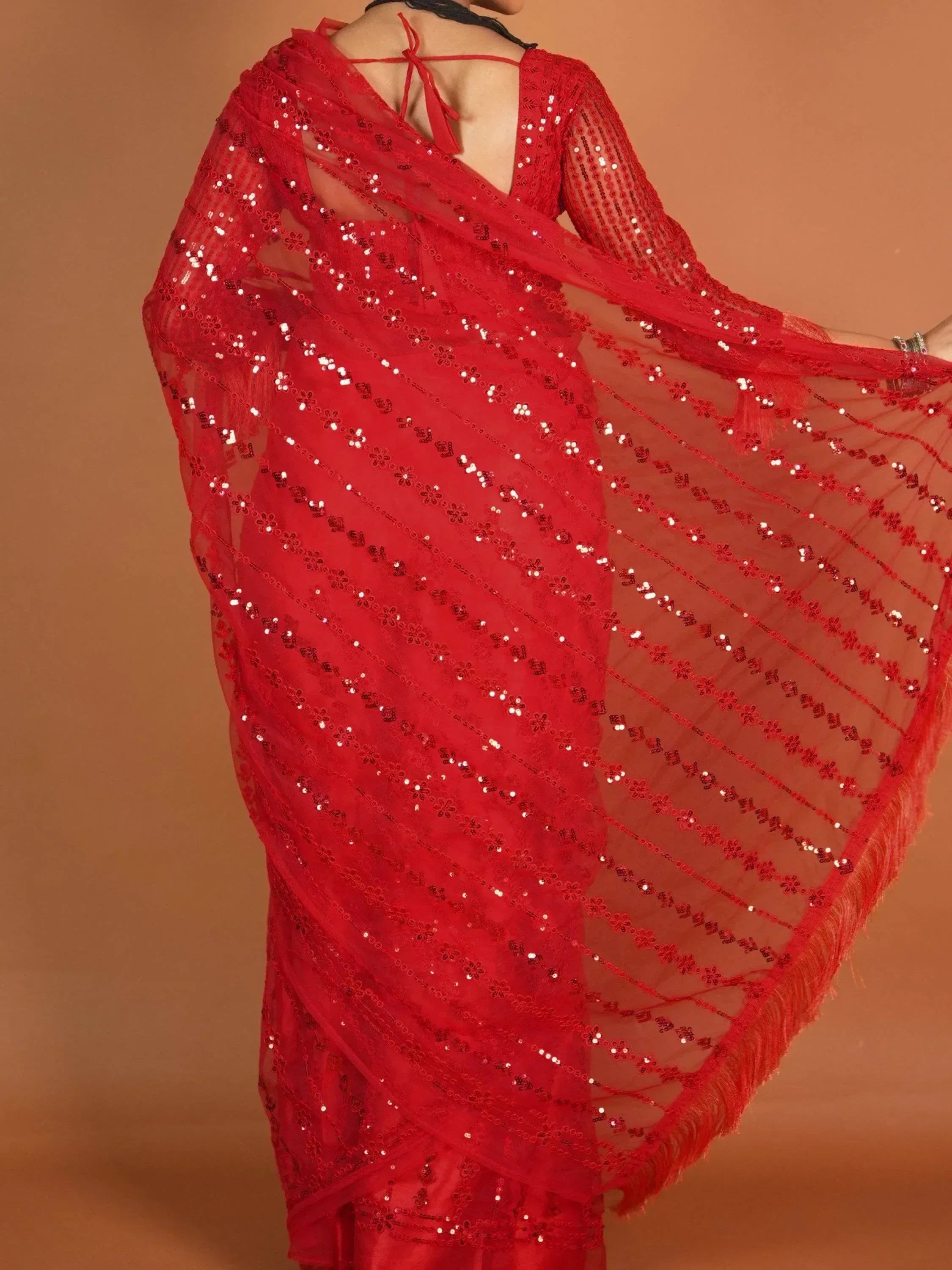 Red sequin saree with floral embroidery and fringe, back view, ethnic wear