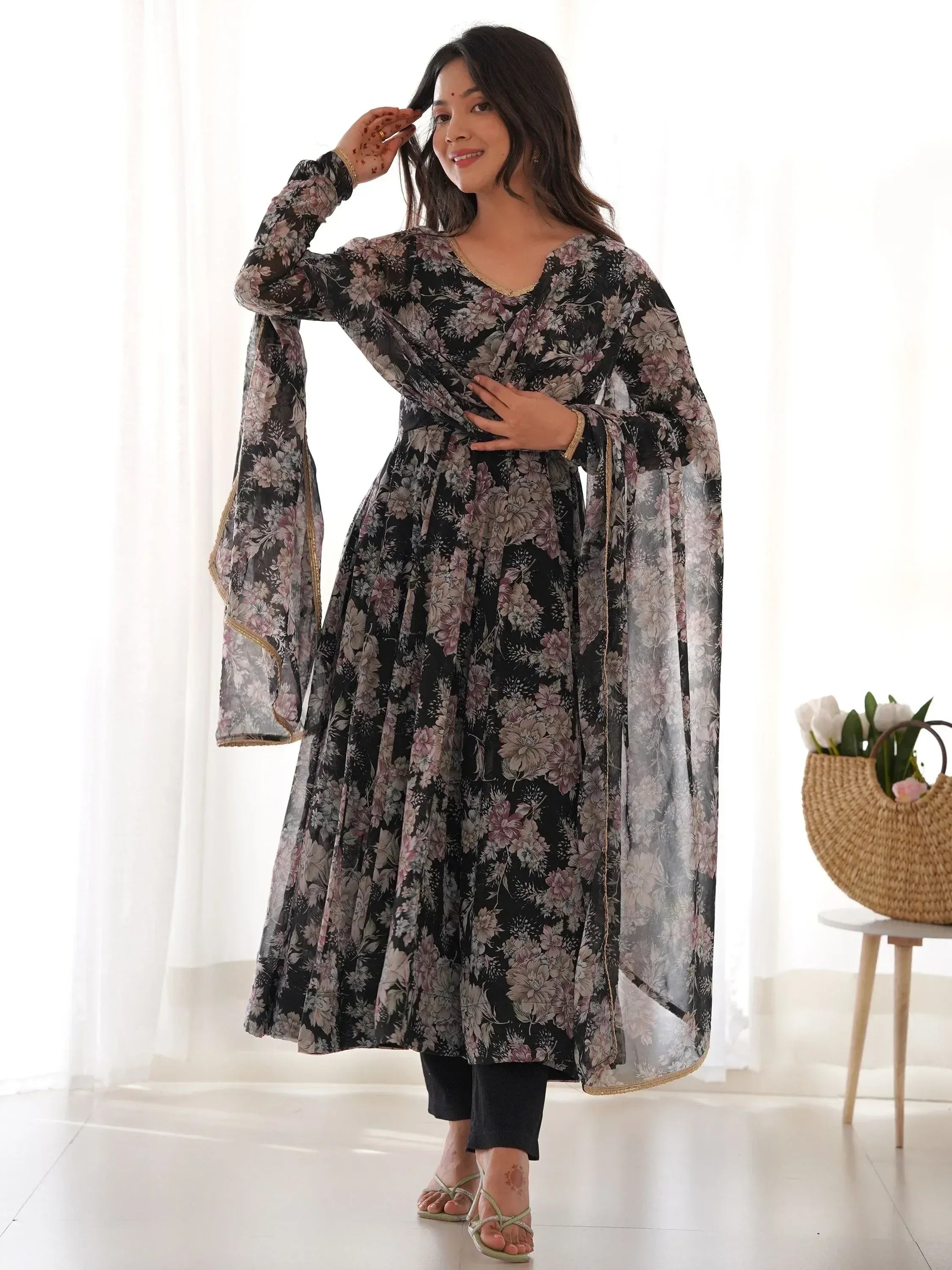 Black floral printed ethnic gown with gold trim, styled with palazzo pants for women