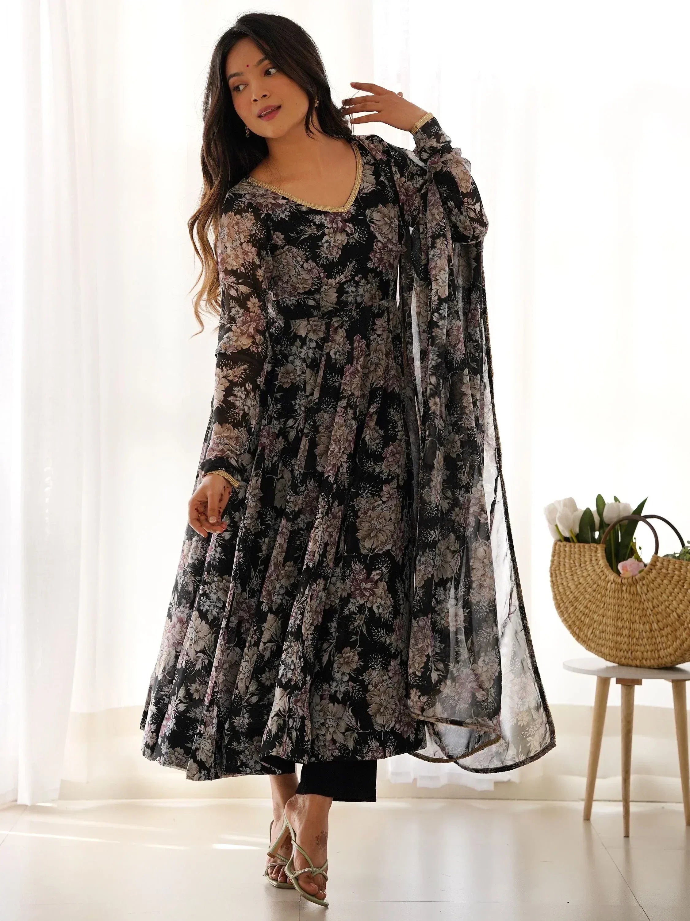 Black floral print ethnic gown with sheer sleeves, perfect for Indian occasions and festive wear.