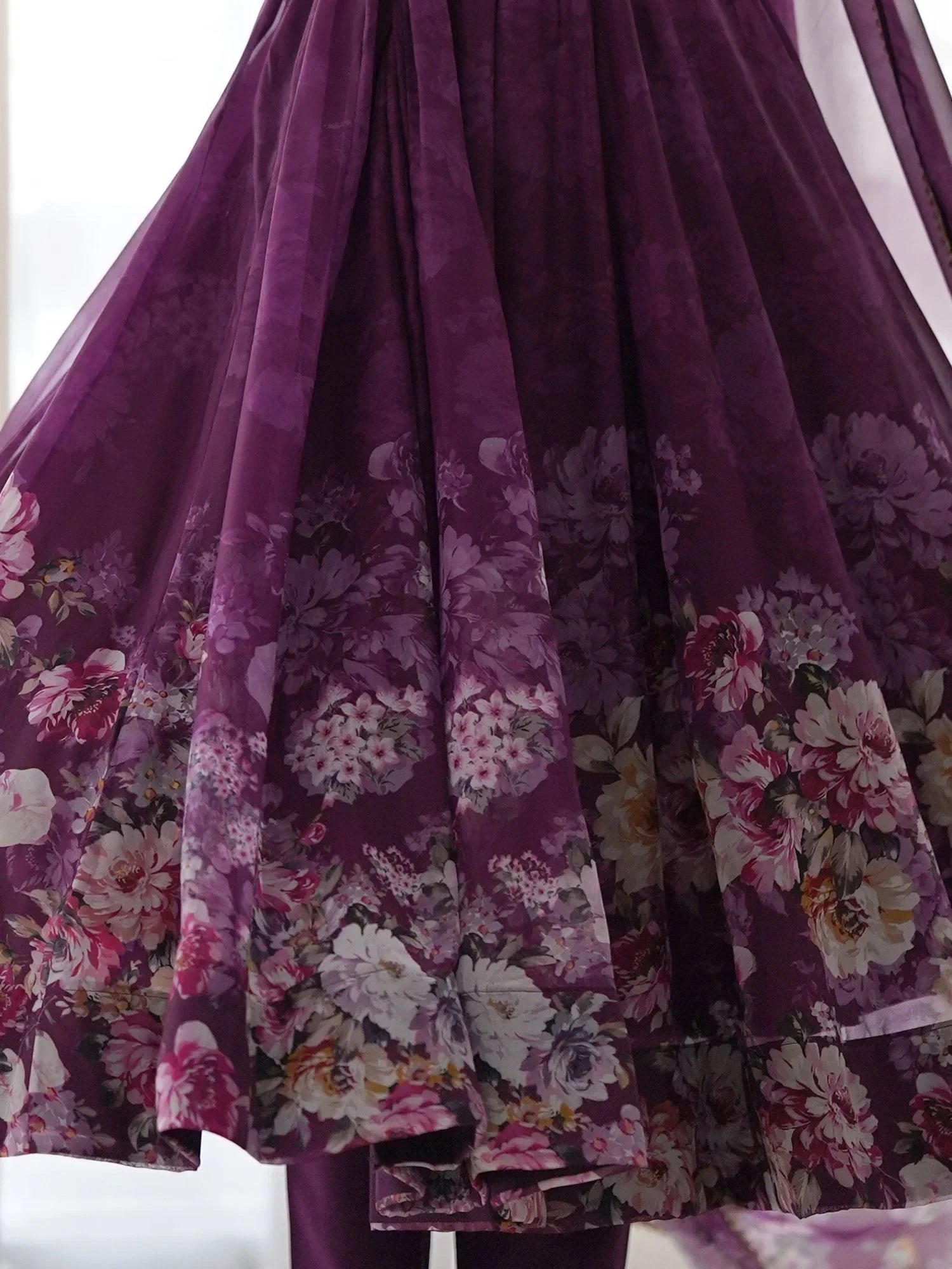 Purple ethnic gown with floral print and flowing sheer fabric