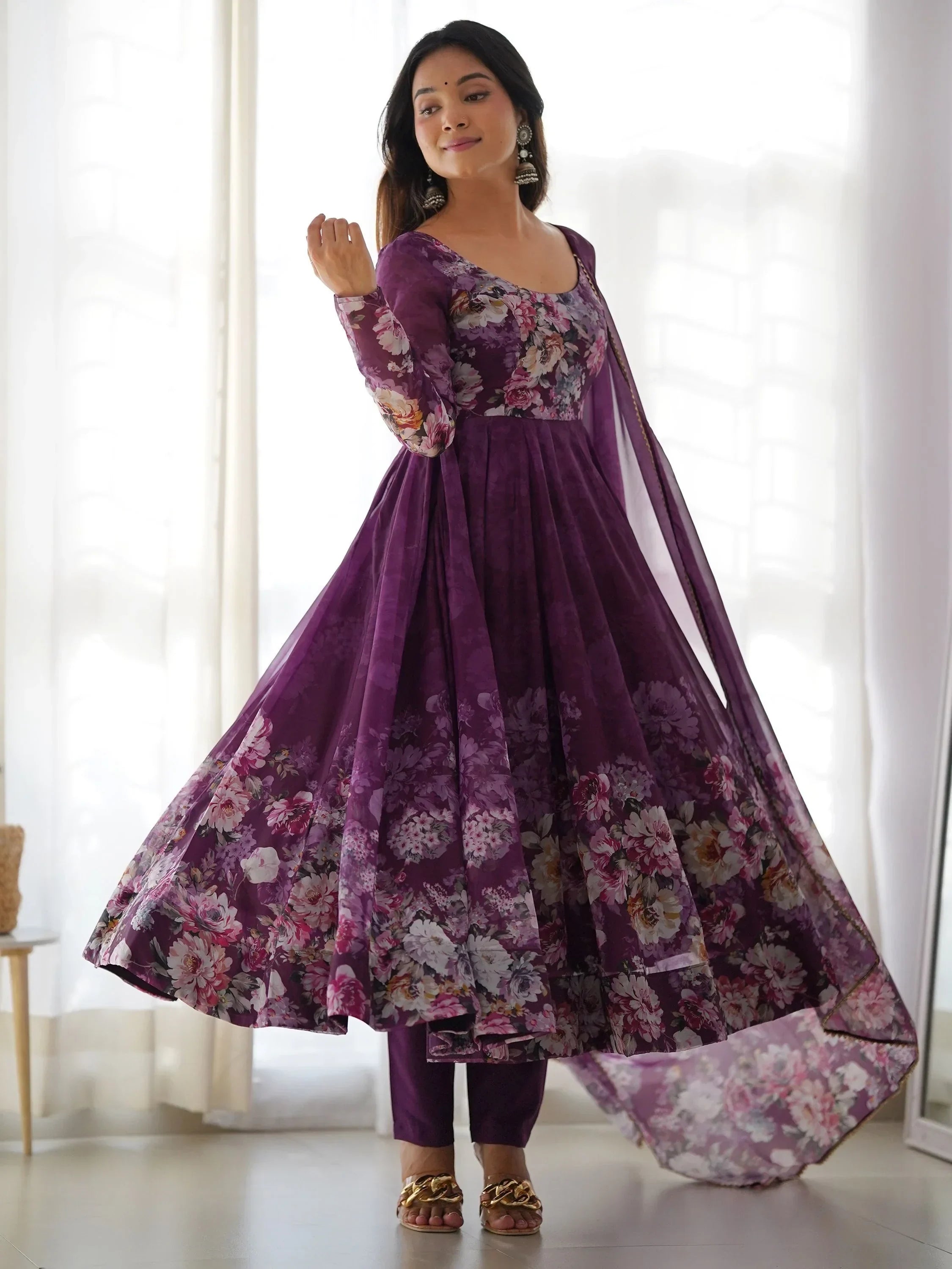 Woman in a purple floral Anarkali suit with dupatta, Indian ethnic wear fashion