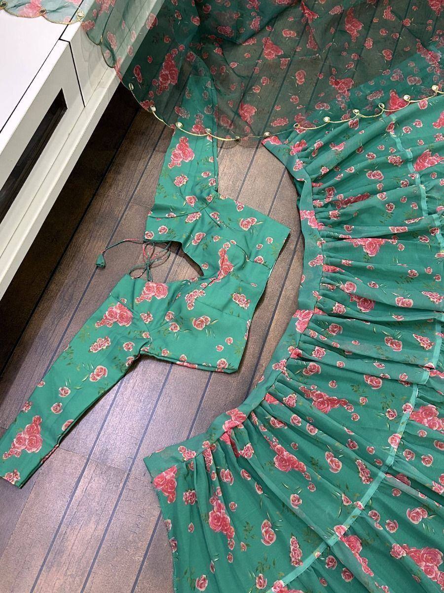 Green floral lehenga choli with ruffled skirt and matching dupatta, ideal for Indian ethnic wear