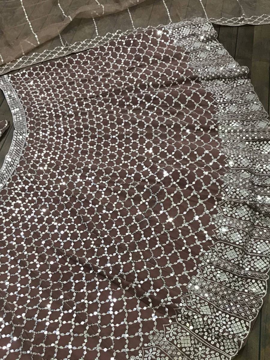 Brown ethnic lehenga with silver mirror work and sequin embroidery, perfect for Indian weddings and festivals