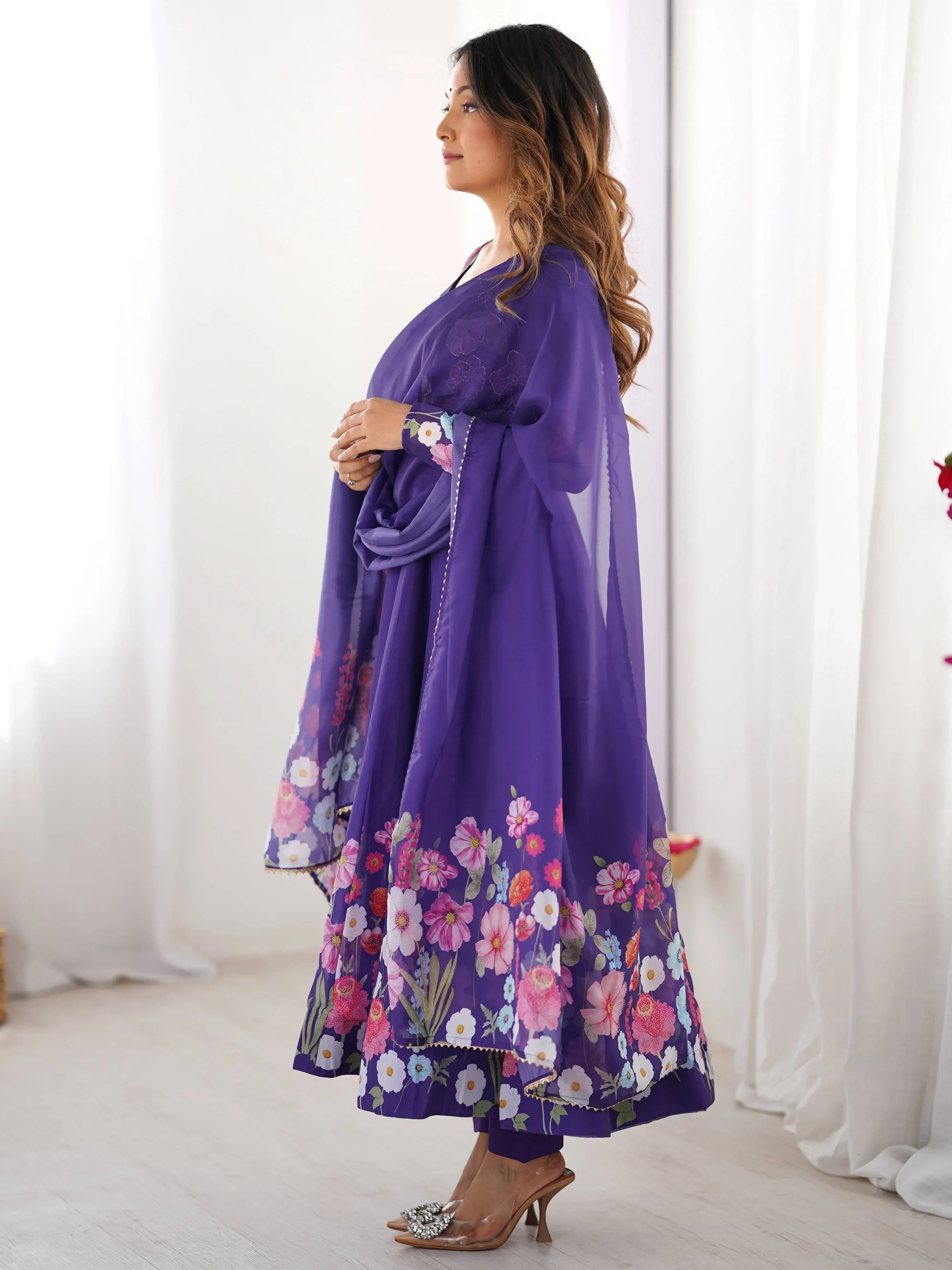 Purple floral printed ethnic gown with matching dupatta, ideal for Indian occasions and festive wear.