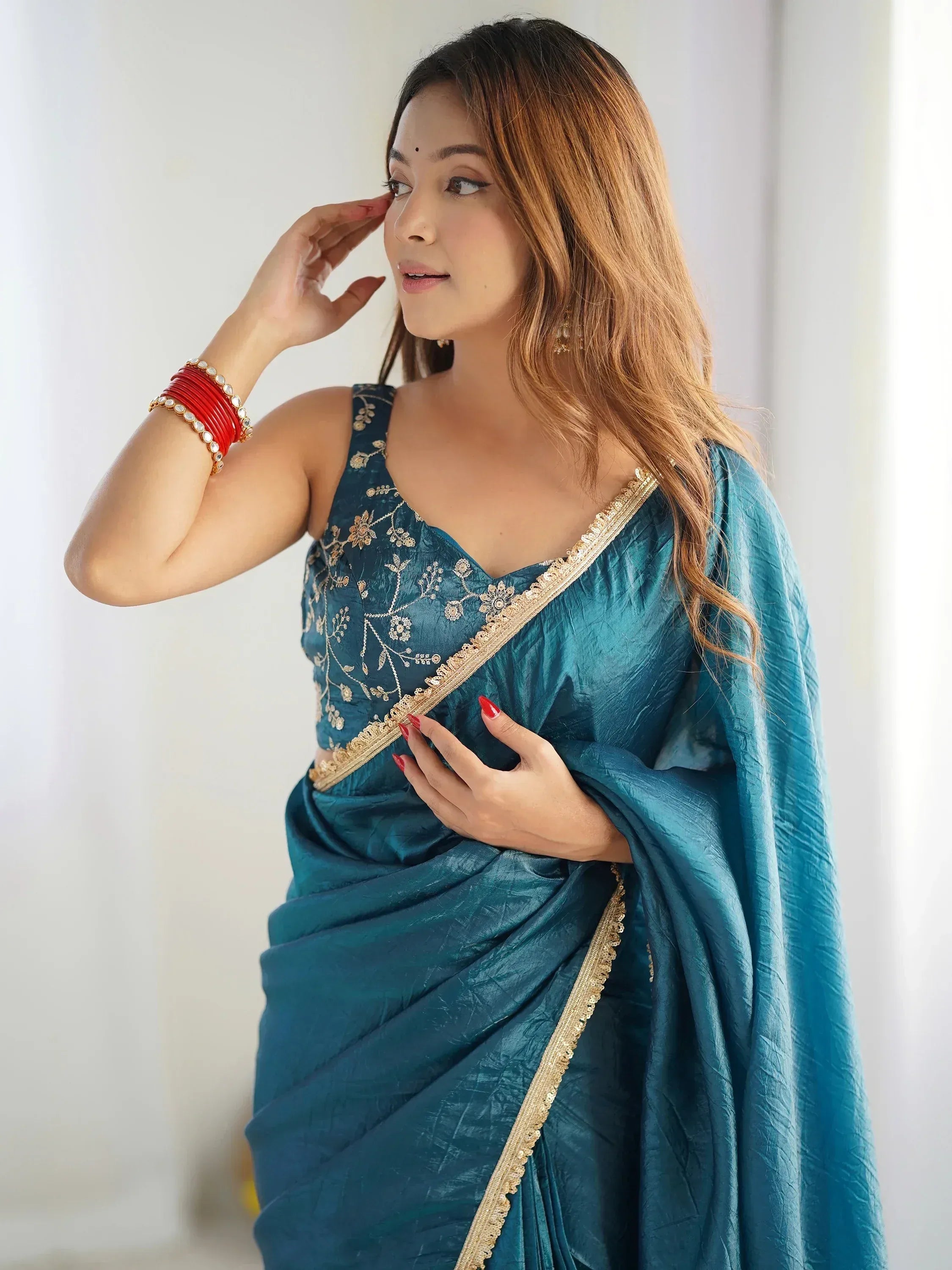 Teal saree with gold embroidery and red bangles, Indian ethnic wear for women