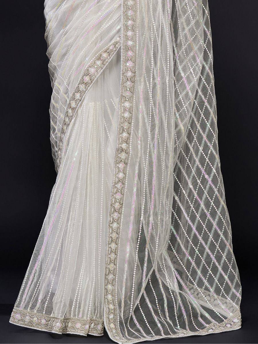 Elegant white saree with intricate beadwork and sequin embroidery, perfect for Indian ethnic wear occasions.