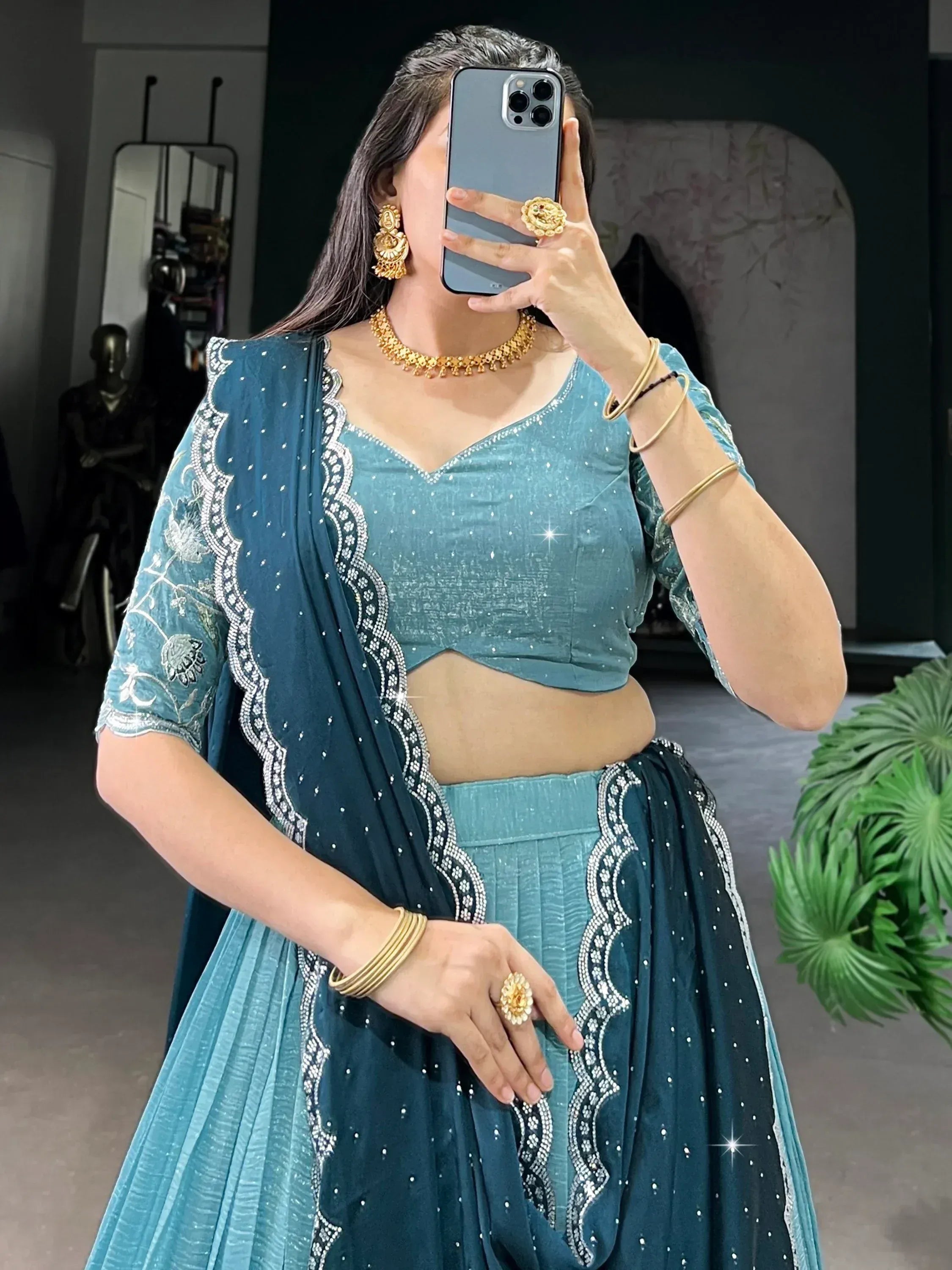 Teal designer lehenga choli with silver embroidery, perfect for Indian ethnic wear events