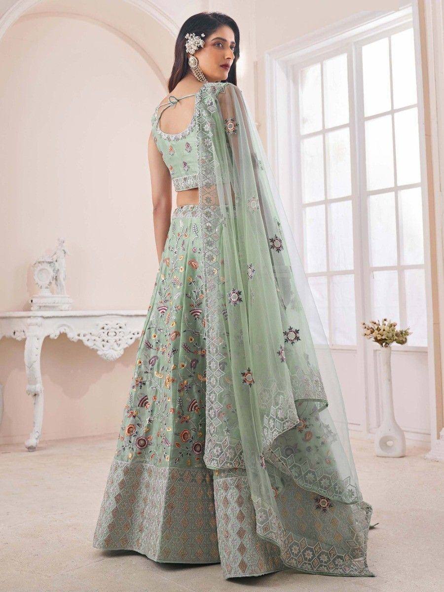 Mint green embroidered lehenga choli with floral motifs and sheer dupatta, perfect for Indian ethnic occasions