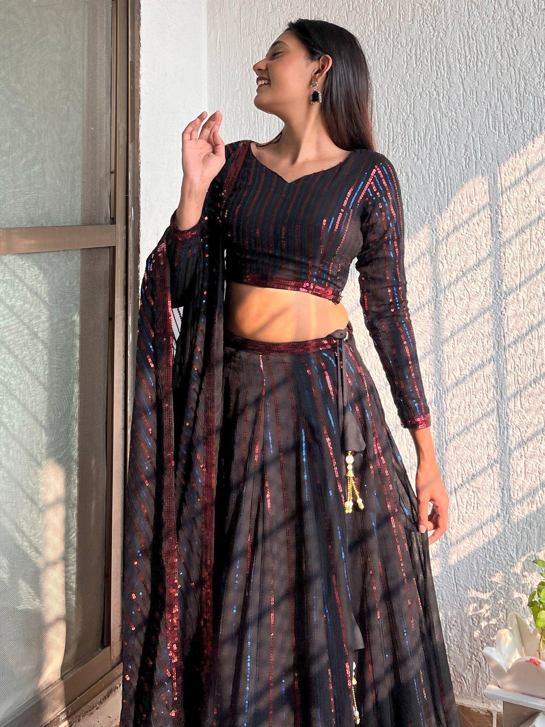Black sequin lehenga choli with red and blue stripes, perfect for Indian ethnic wear events