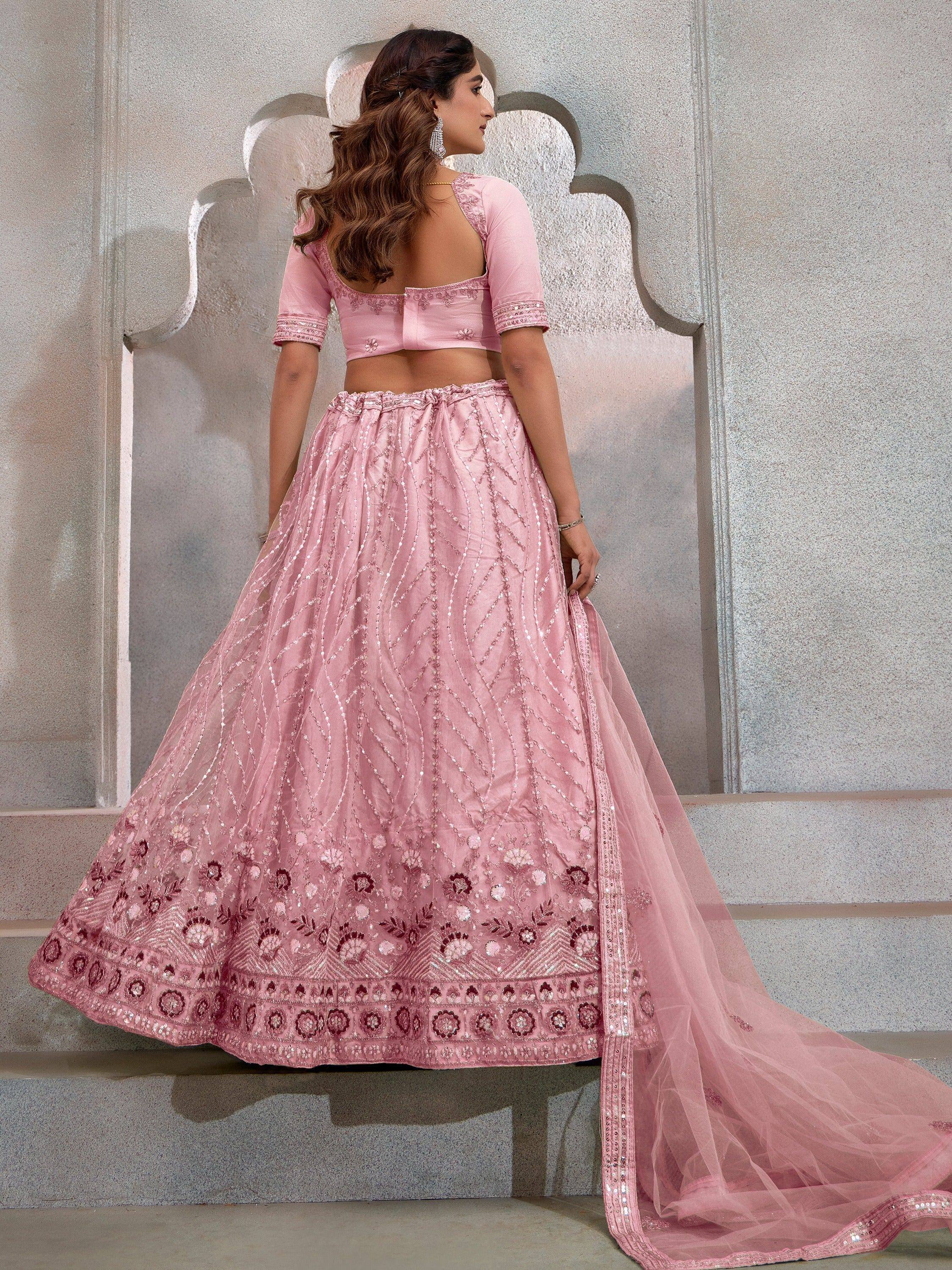 Pink embroidered lehenga choli with floral motifs and sequin detailing, perfect for Indian ethnic wear occasions.