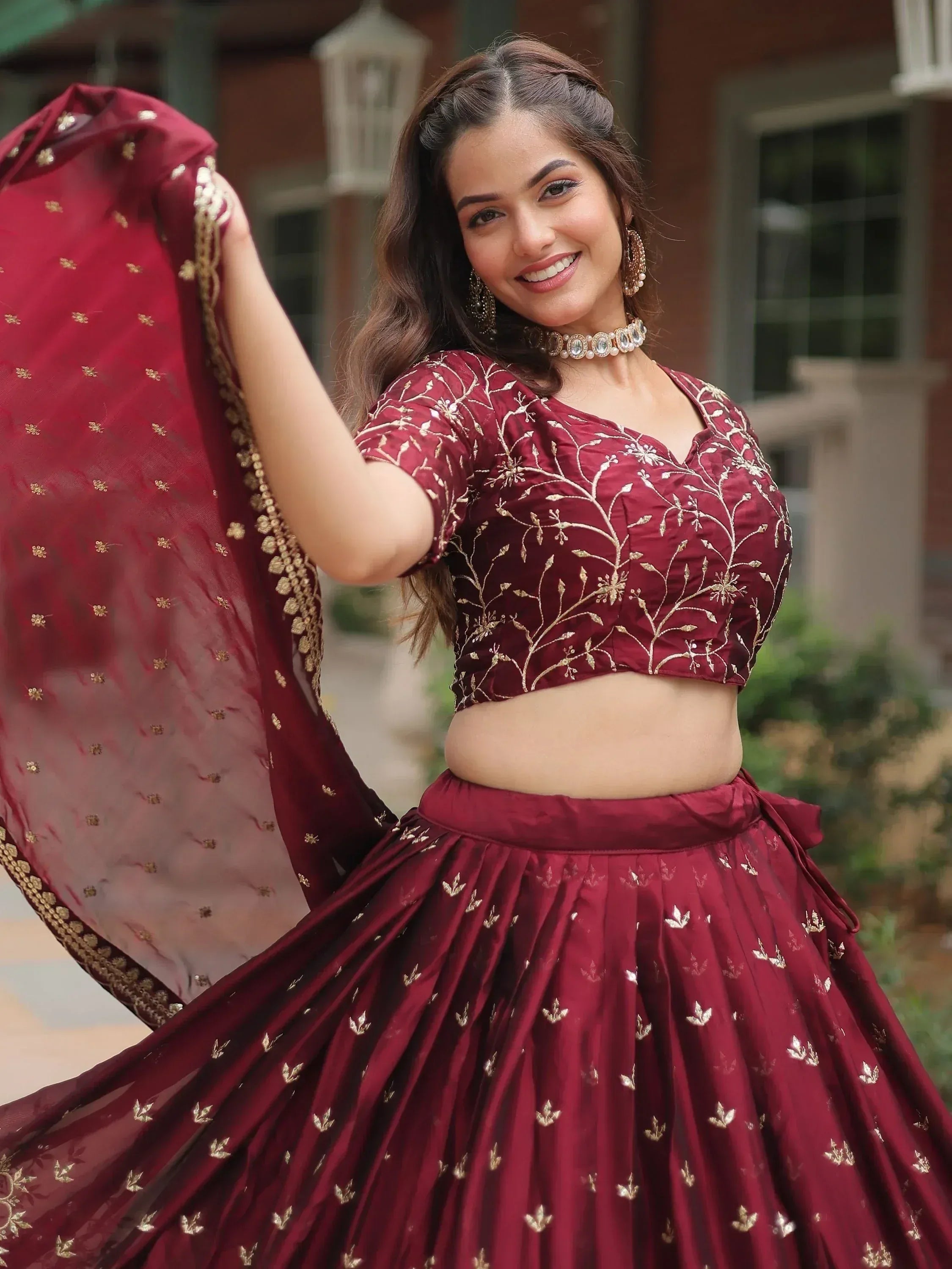 Maroon embroidered lehenga choli with gold floral work, perfect for Indian ethnic wear occasions