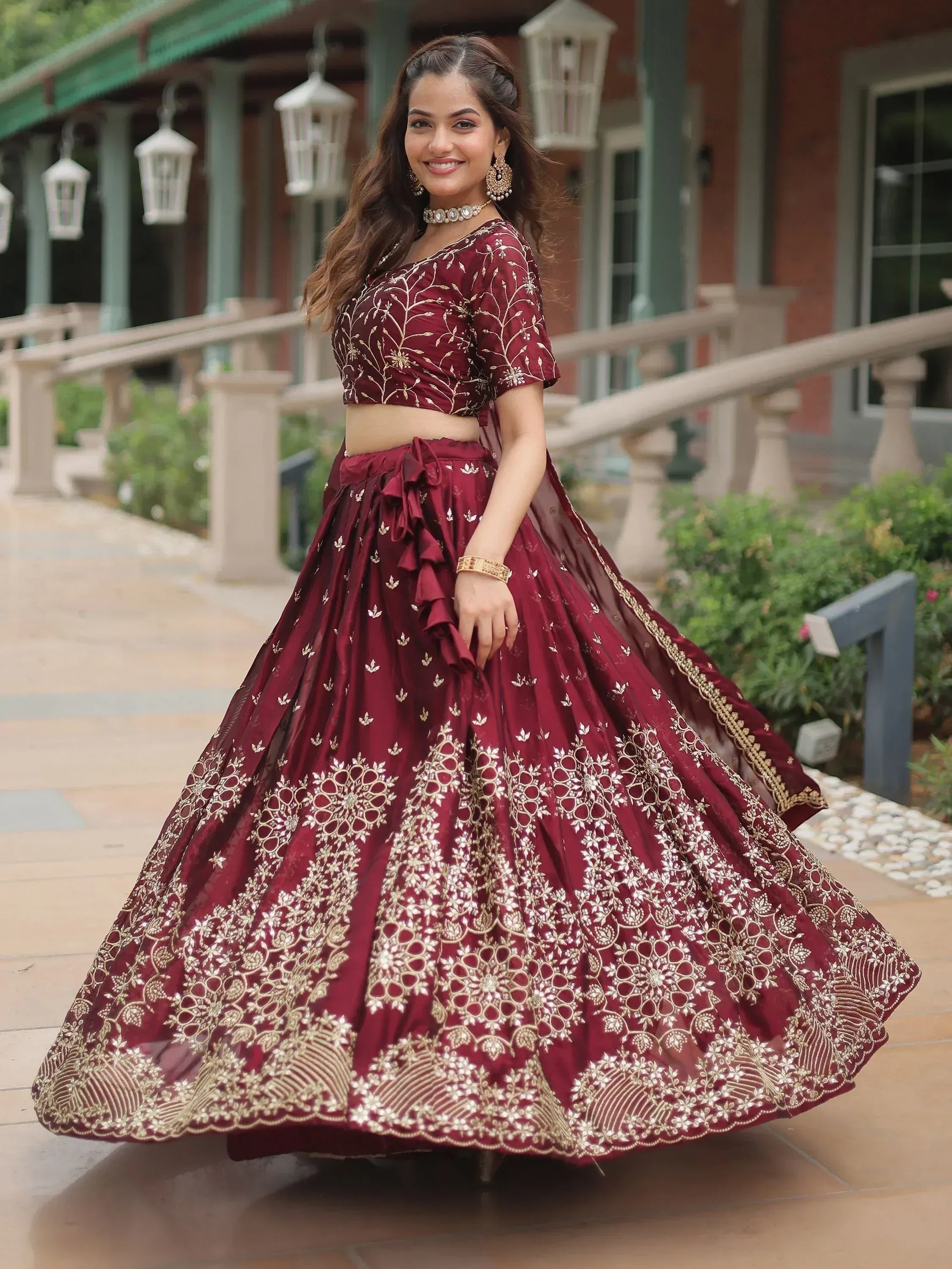 Maroon designer lehenga choli with gold embroidery, perfect for Indian ethnic wear events