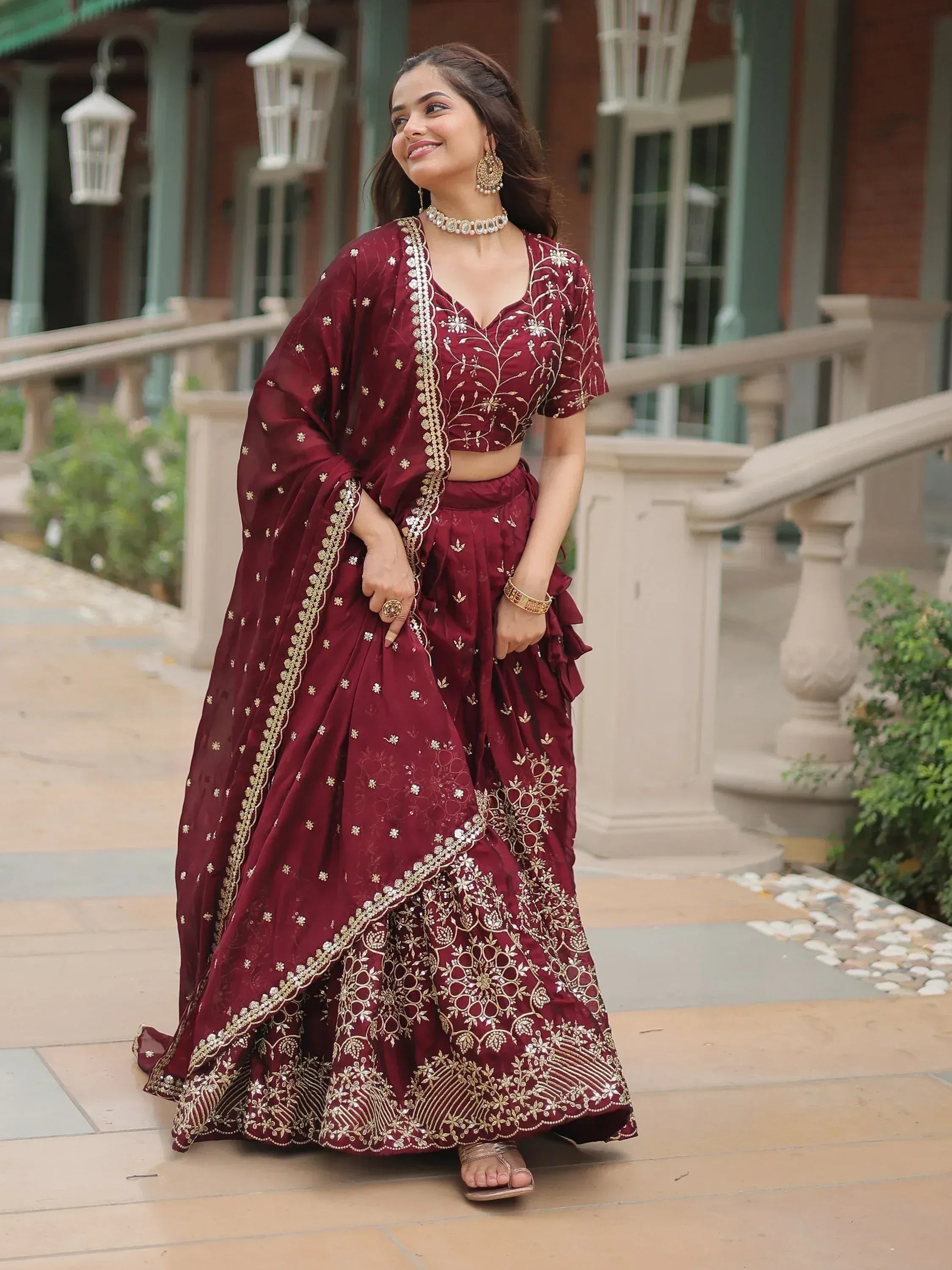 Maroon embroidered lehenga choli with gold detailing, perfect for Indian ethnic wear occasions