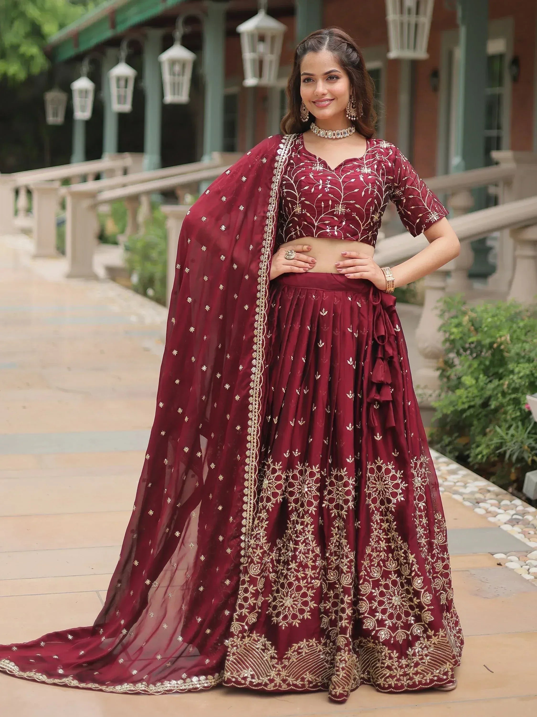 Maroon embroidered lehenga choli with gold detailing, perfect for Indian ethnic wear occasions