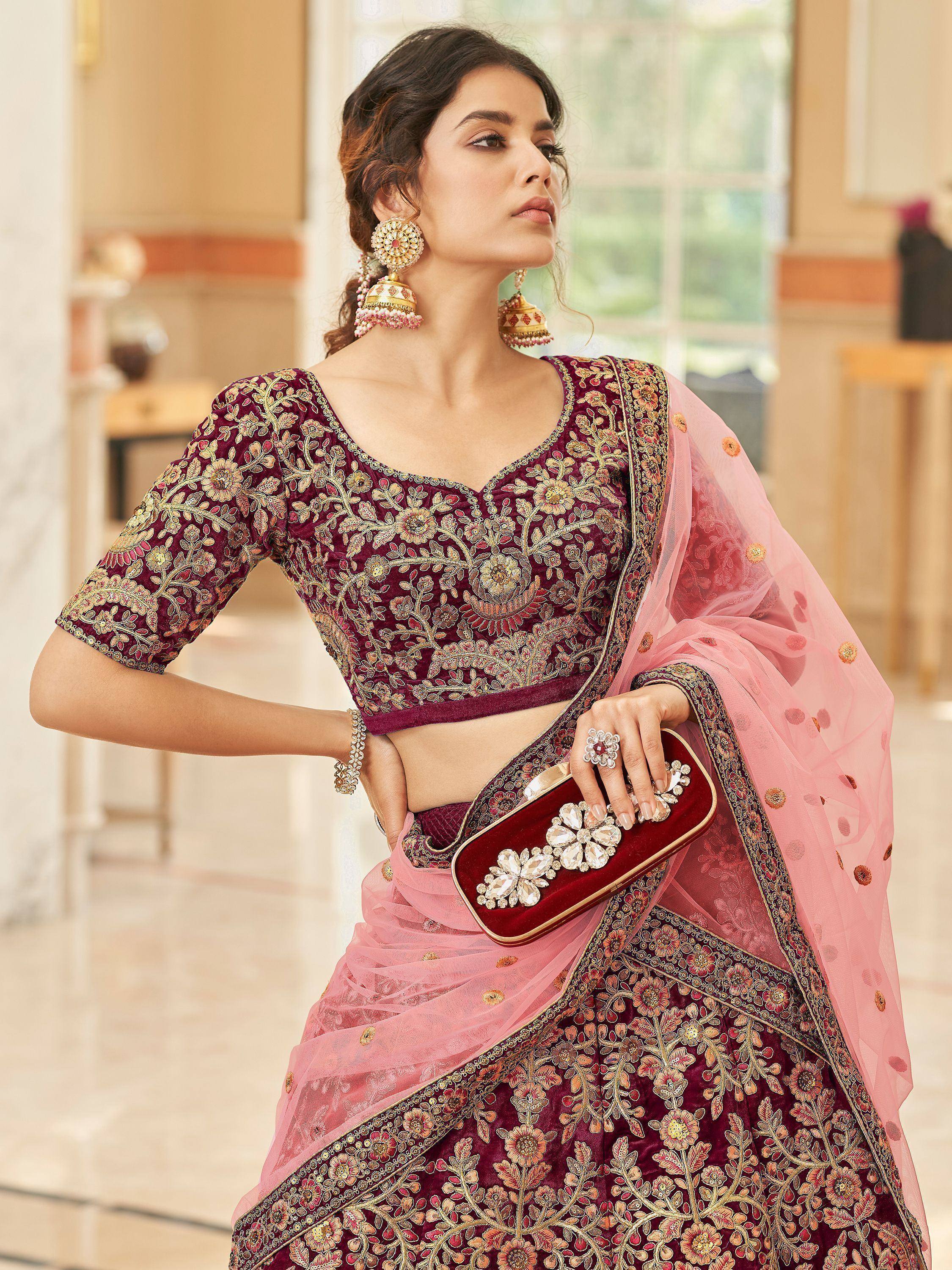 Maroon embroidered lehenga choli with pink dupatta, perfect for Indian weddings and festive occasions