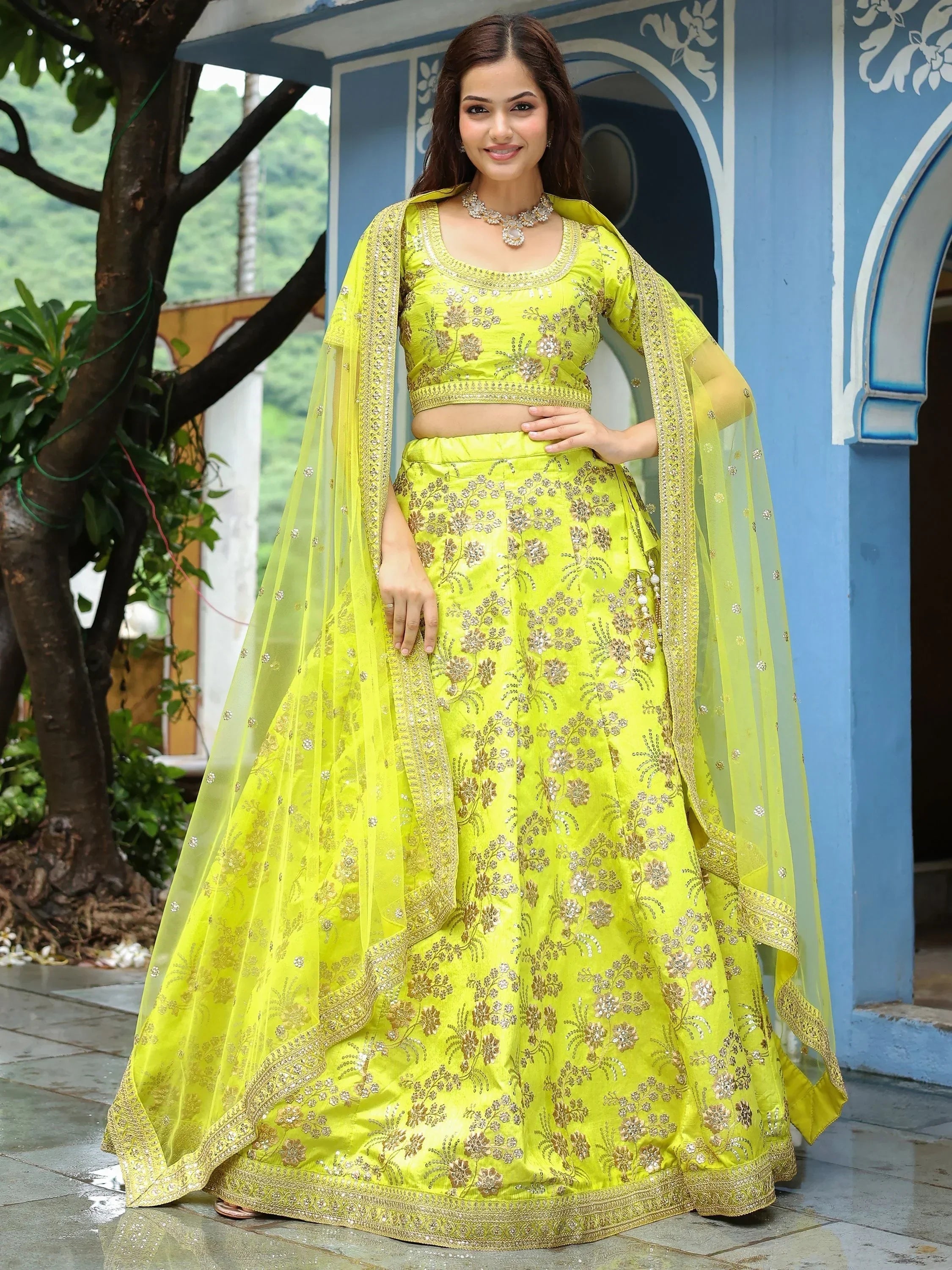 Lime green embroidered lehenga choli with gold floral work and matching dupatta, perfect for Indian ethnic occasions.