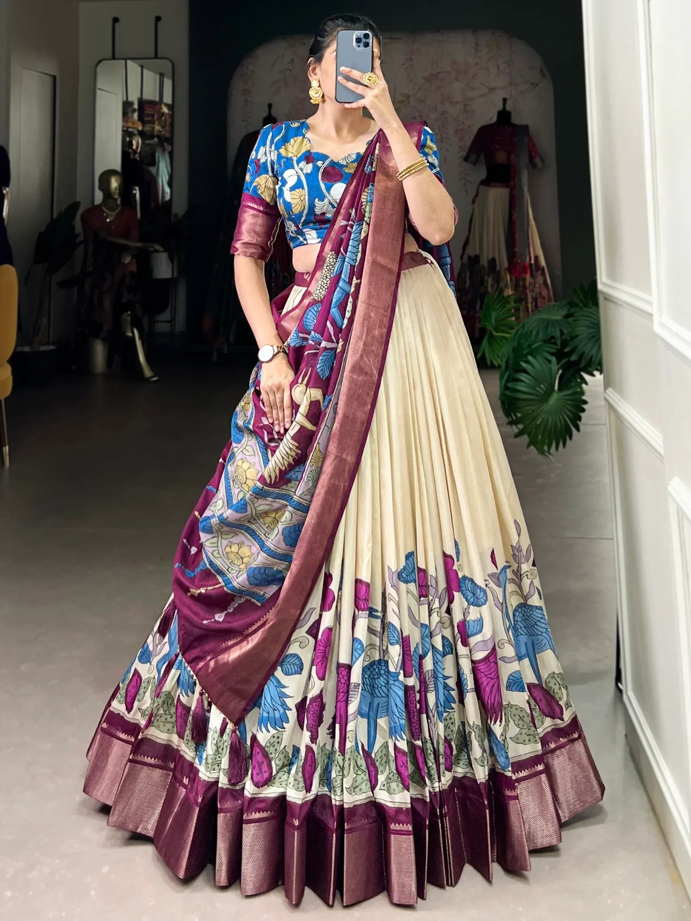 Woman in floral print lehenga choli with blue and maroon dupatta, ethnic Indian wear