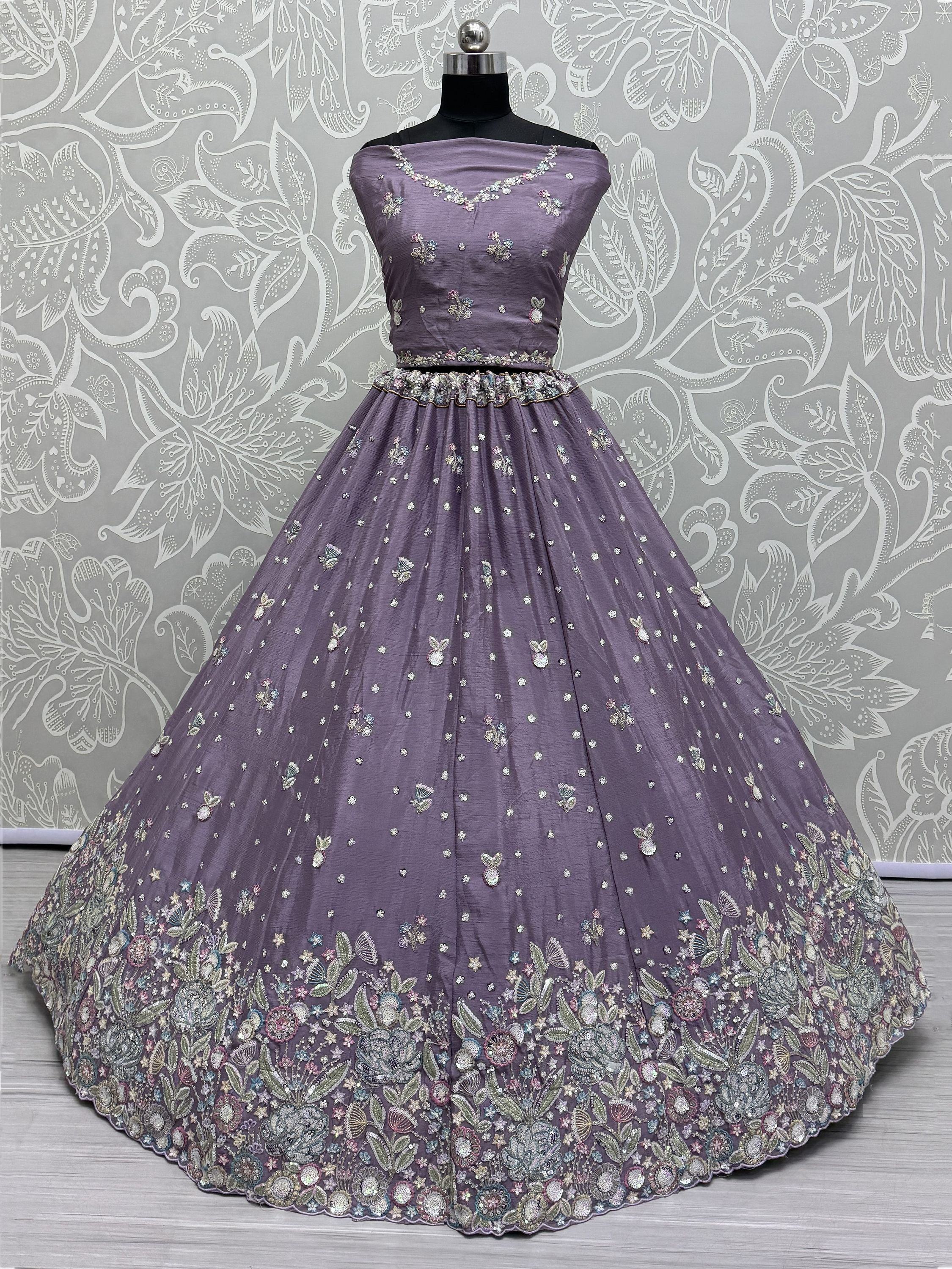 Purple embroidered lehenga choli with floral motifs, perfect for Indian ethnic wear and festive occasions.