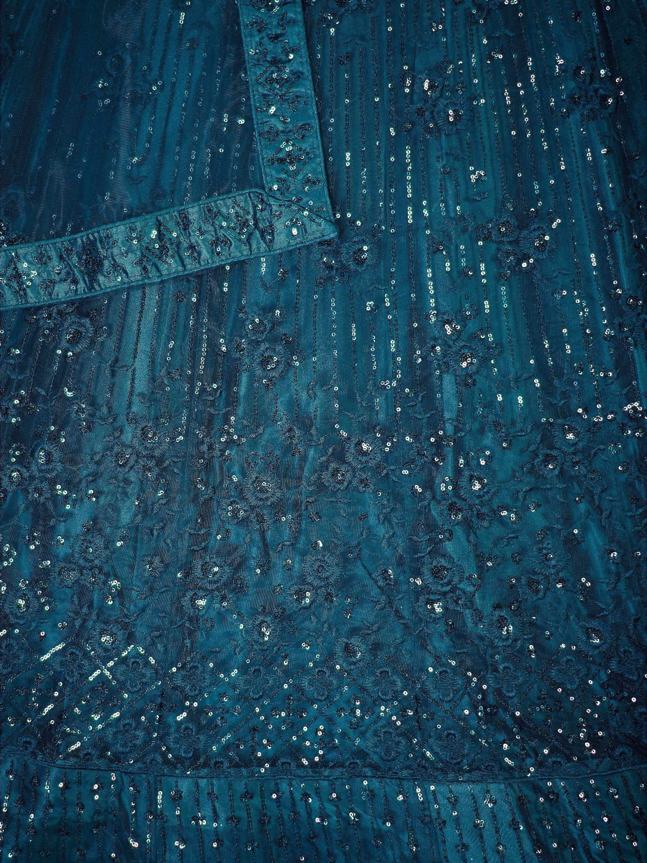 Teal ethnic gown with intricate sequin embroidery and floral patterns, perfect for festive occasions.
