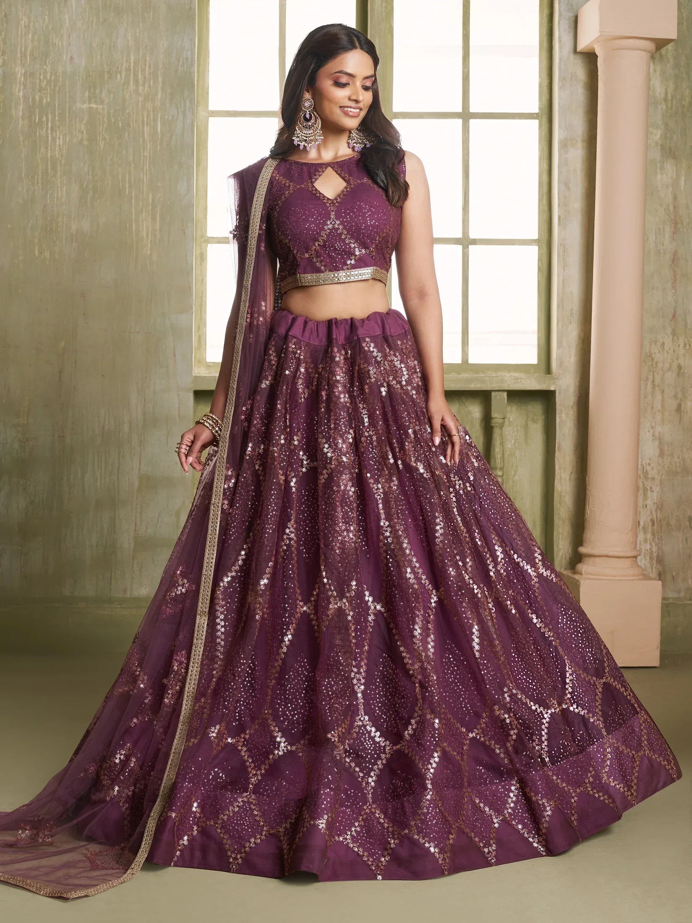 Purple sequin lehenga choli with gold embroidery, perfect for Indian weddings and festive occasions.