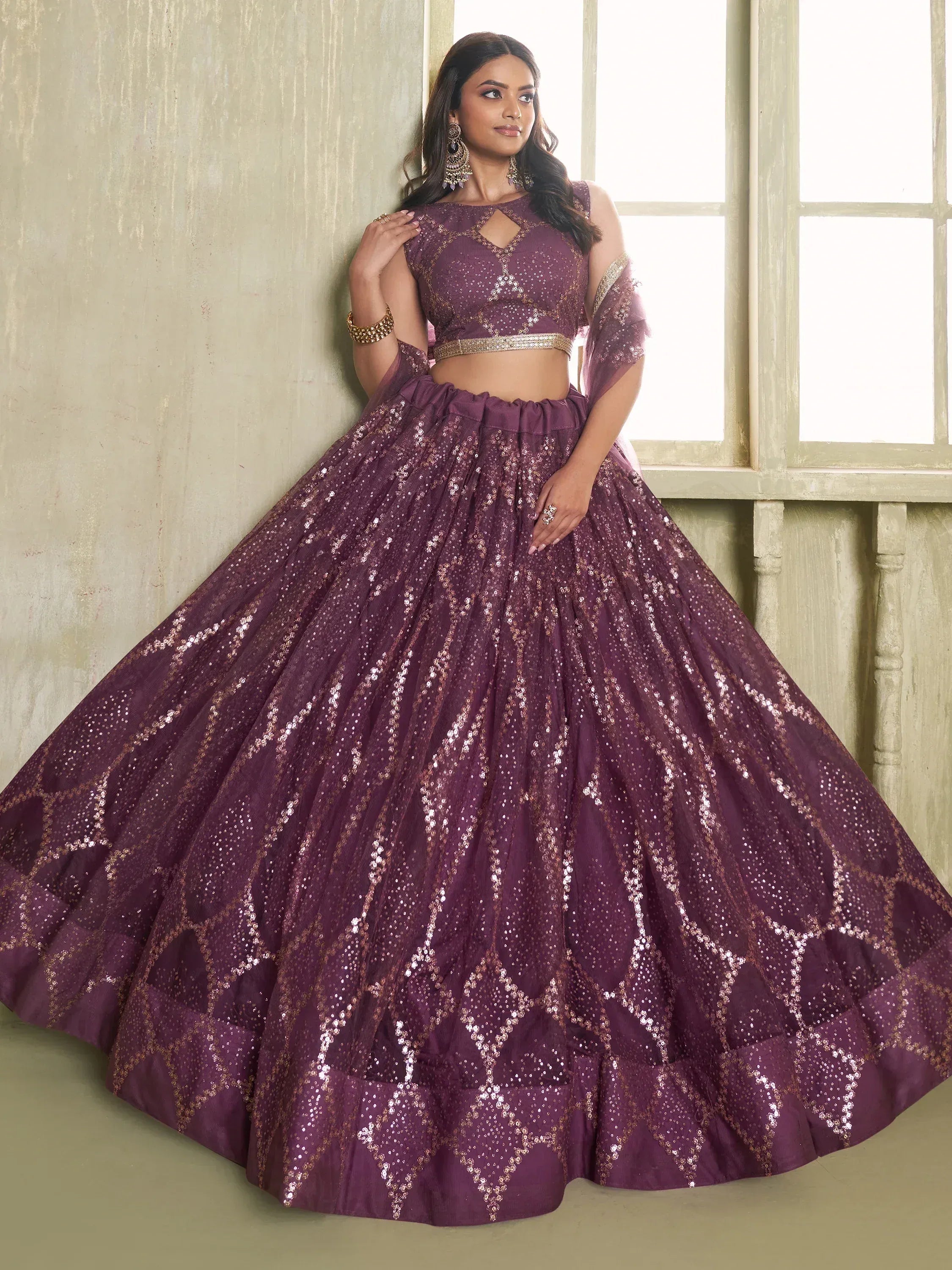 Purple sequin lehenga choli with gold detailing, perfect for Indian weddings and festive occasions.