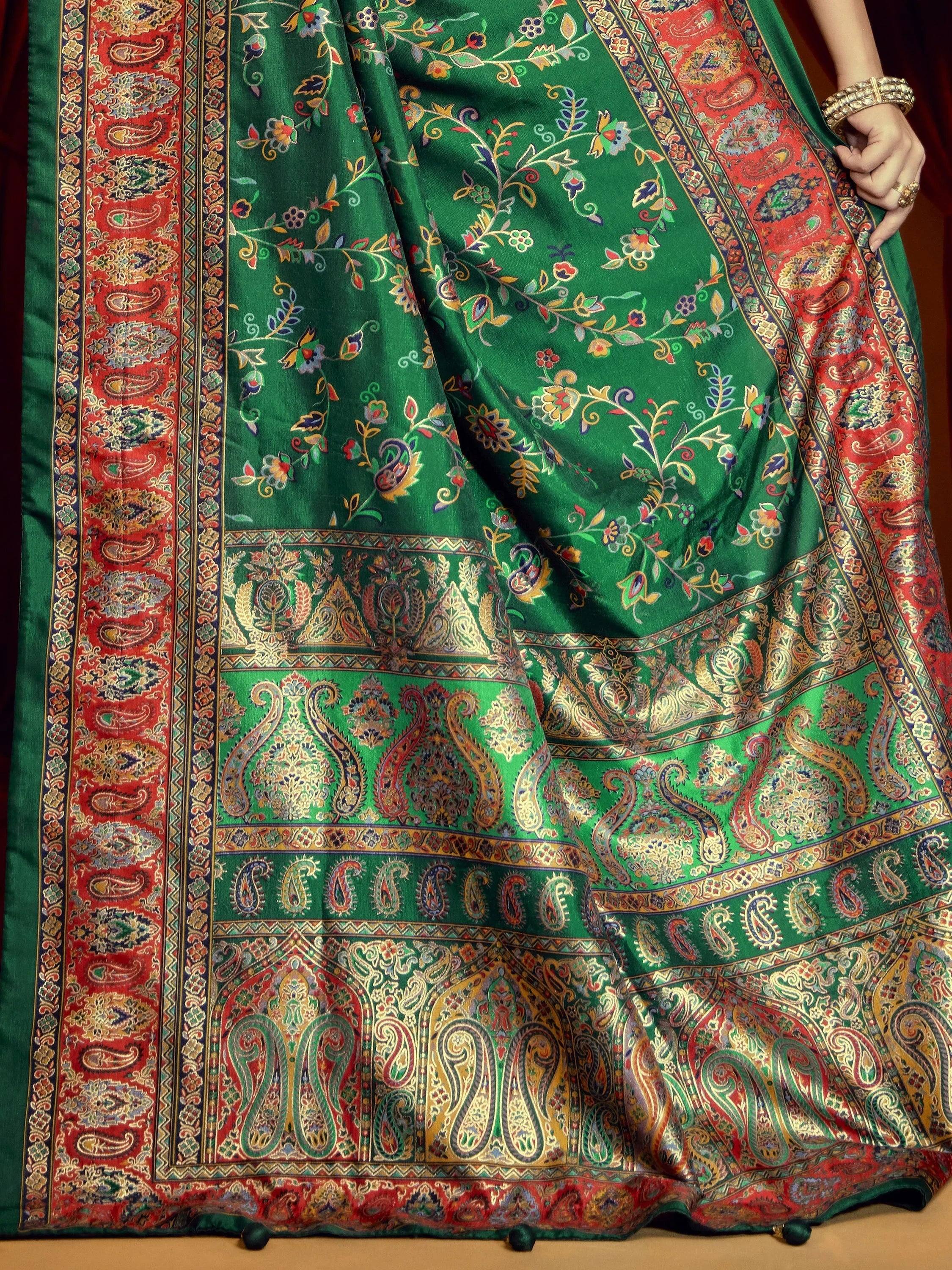 Green and red paisley printed Indian saree with floral motifs and gold border, perfect for ethnic occasions.