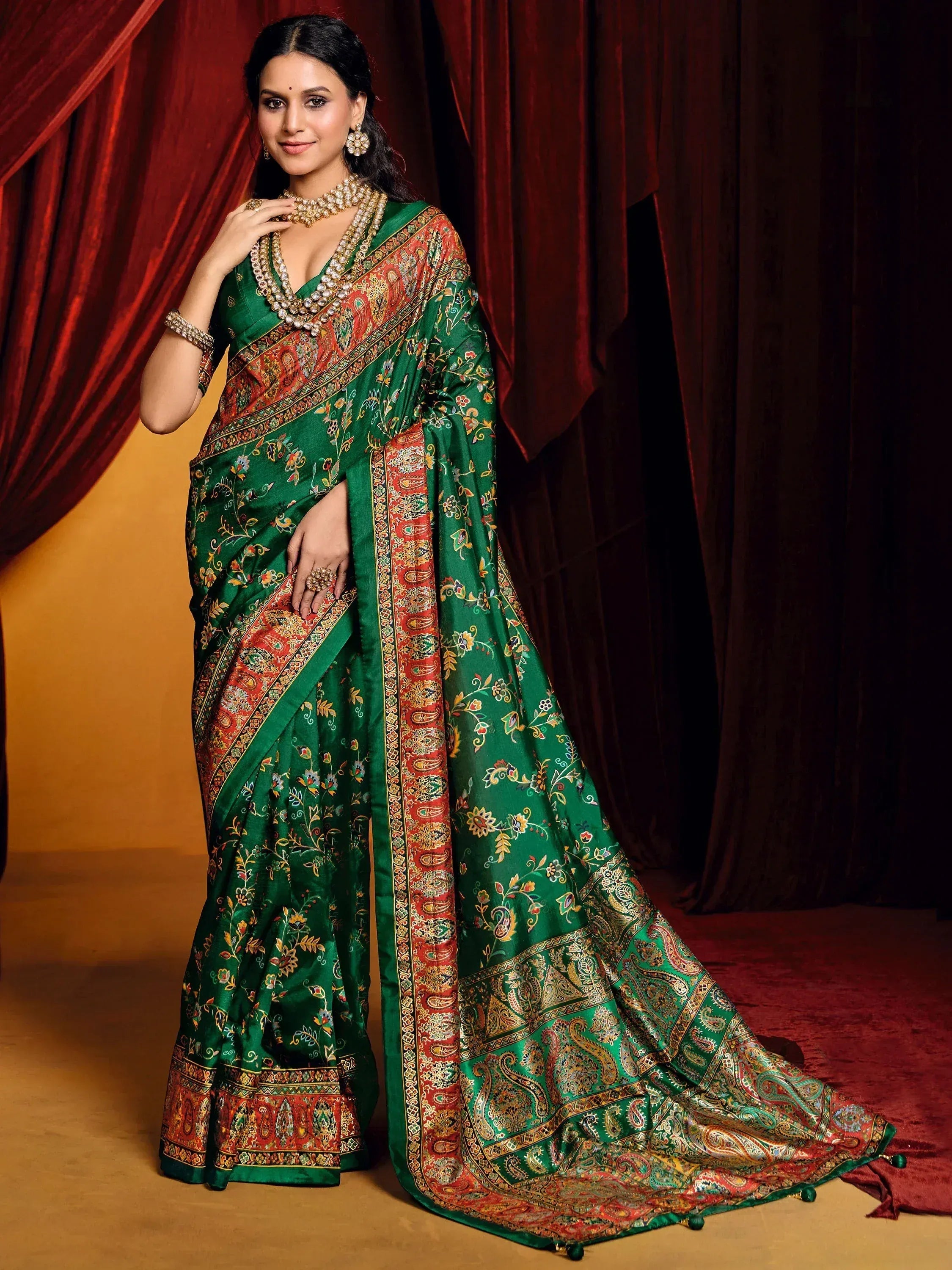 Elegant green designer saree with floral and paisley print, perfect for Indian ethnic wear occasions.