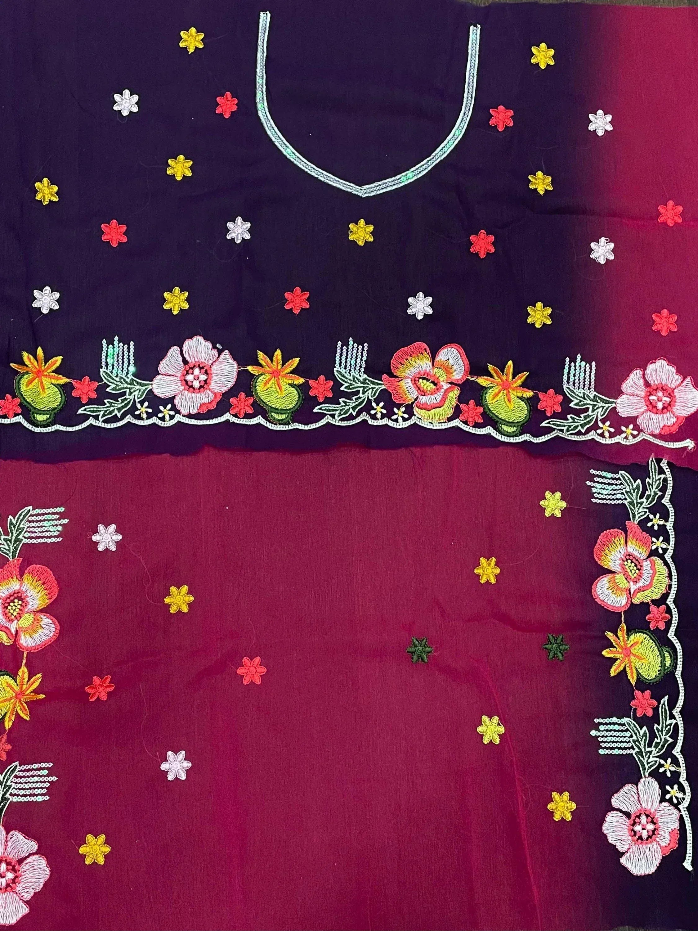 Embroidered ethnic blouse with floral patterns and vibrant colors