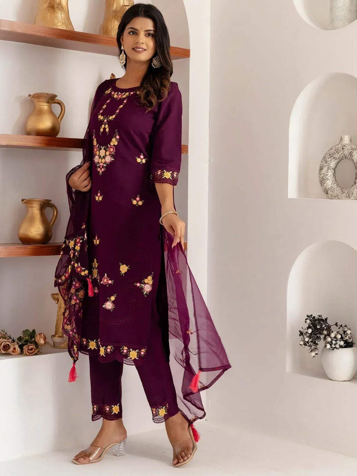 Purple embroidered salwar kameez with floral design and matching dupatta, ideal for ethnic wear occasions