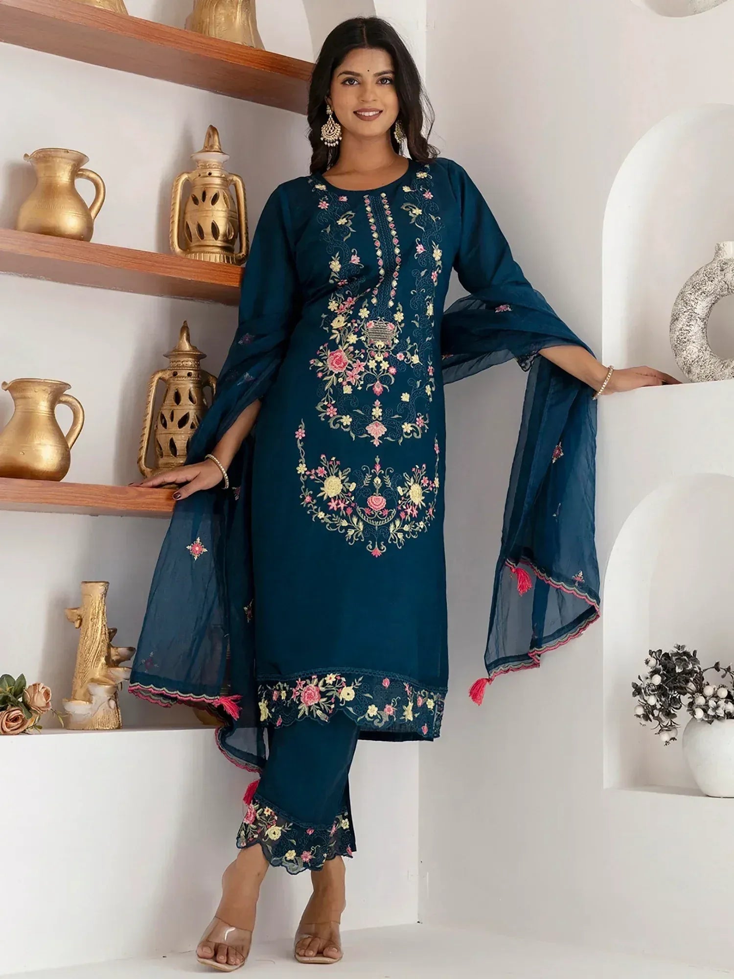 Teal embroidered salwar kameez with floral design, bell sleeves, and matching dupatta for ethnic wear