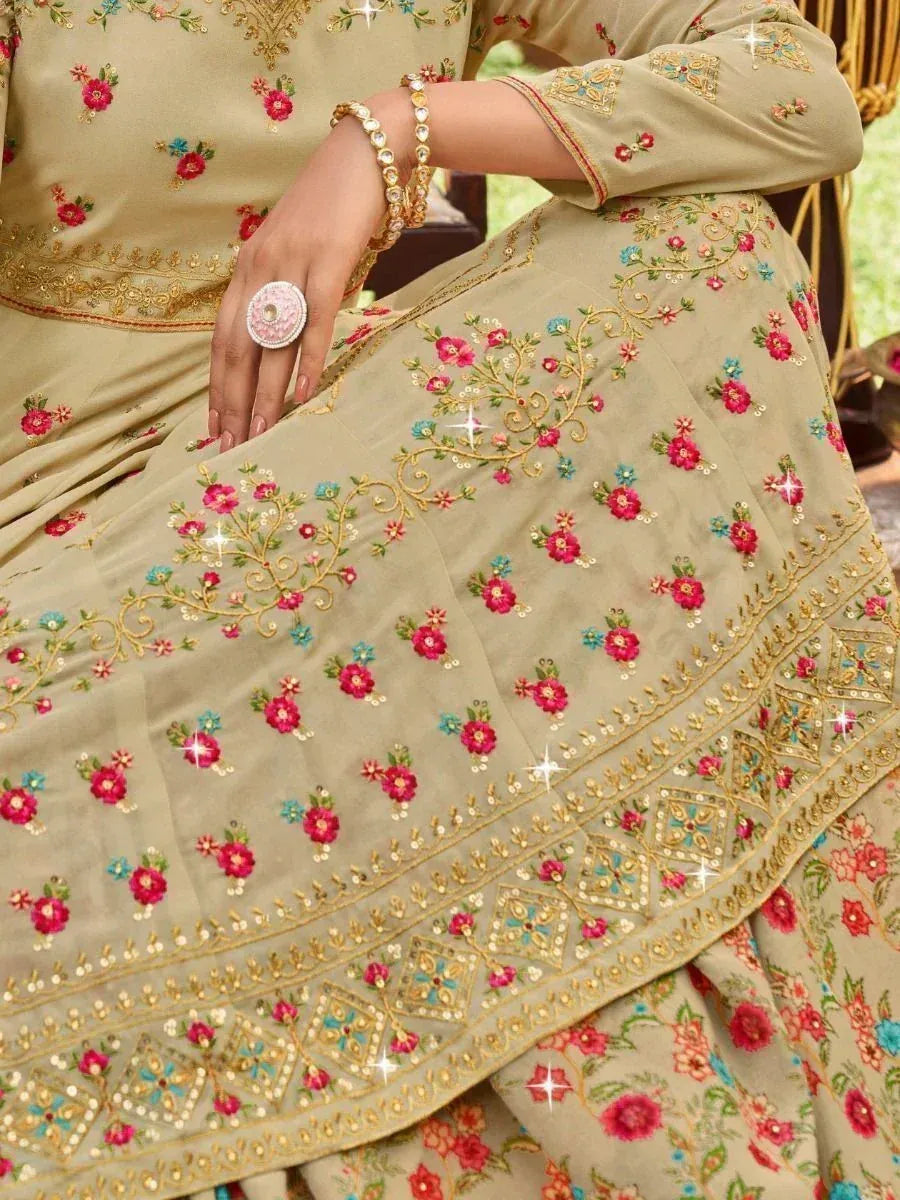 Beige floral embroidered lehenga choli with gold detailing, perfect for Indian ethnic wear occasions
