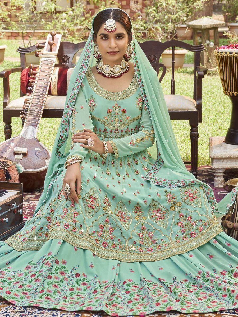 Mint green embroidered lehenga choli with floral motifs, traditional Indian ethnic wear for weddings