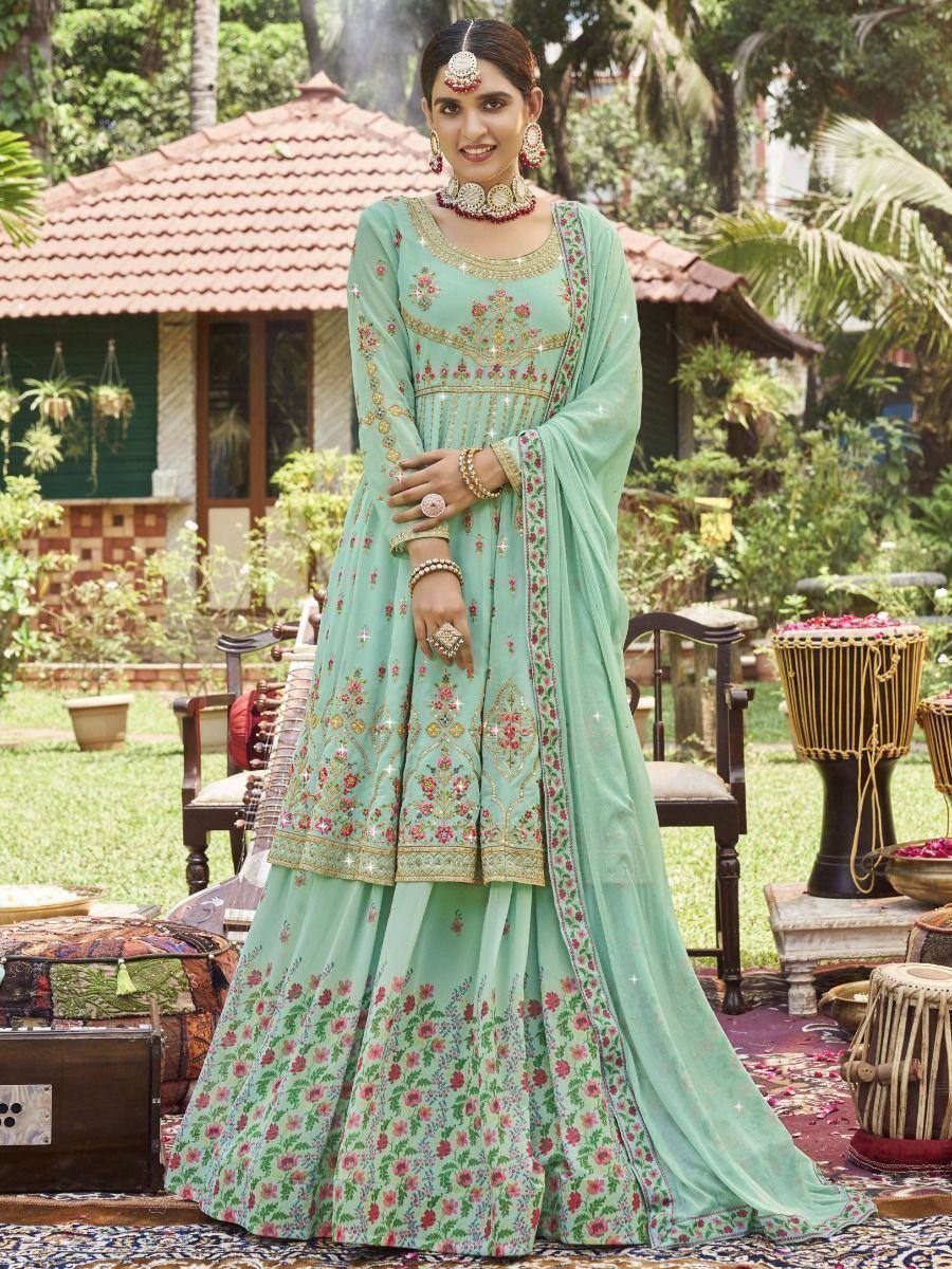 Mint green floral embroidered lehenga choli with gold detailing, perfect for Indian ethnic occasions