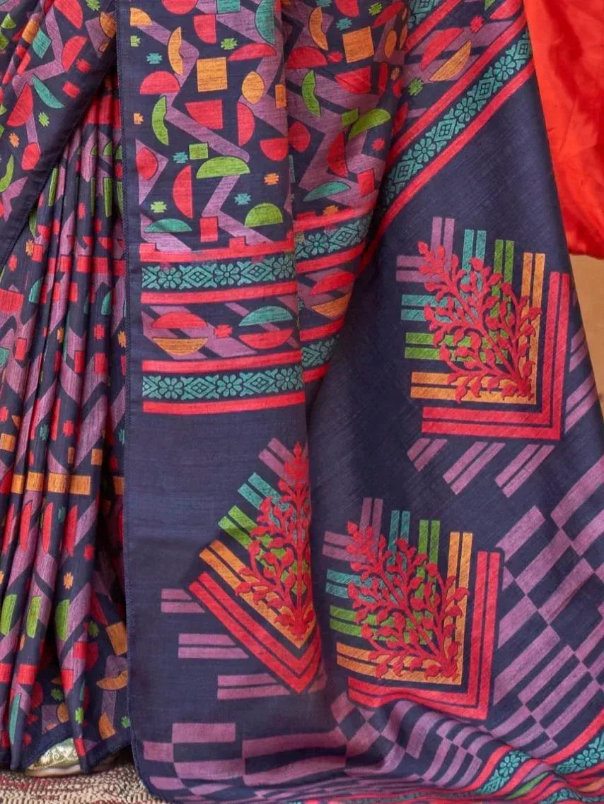 Vibrant geometric print saree with red, green, and purple motifs on dark base, ideal for ethnic wear