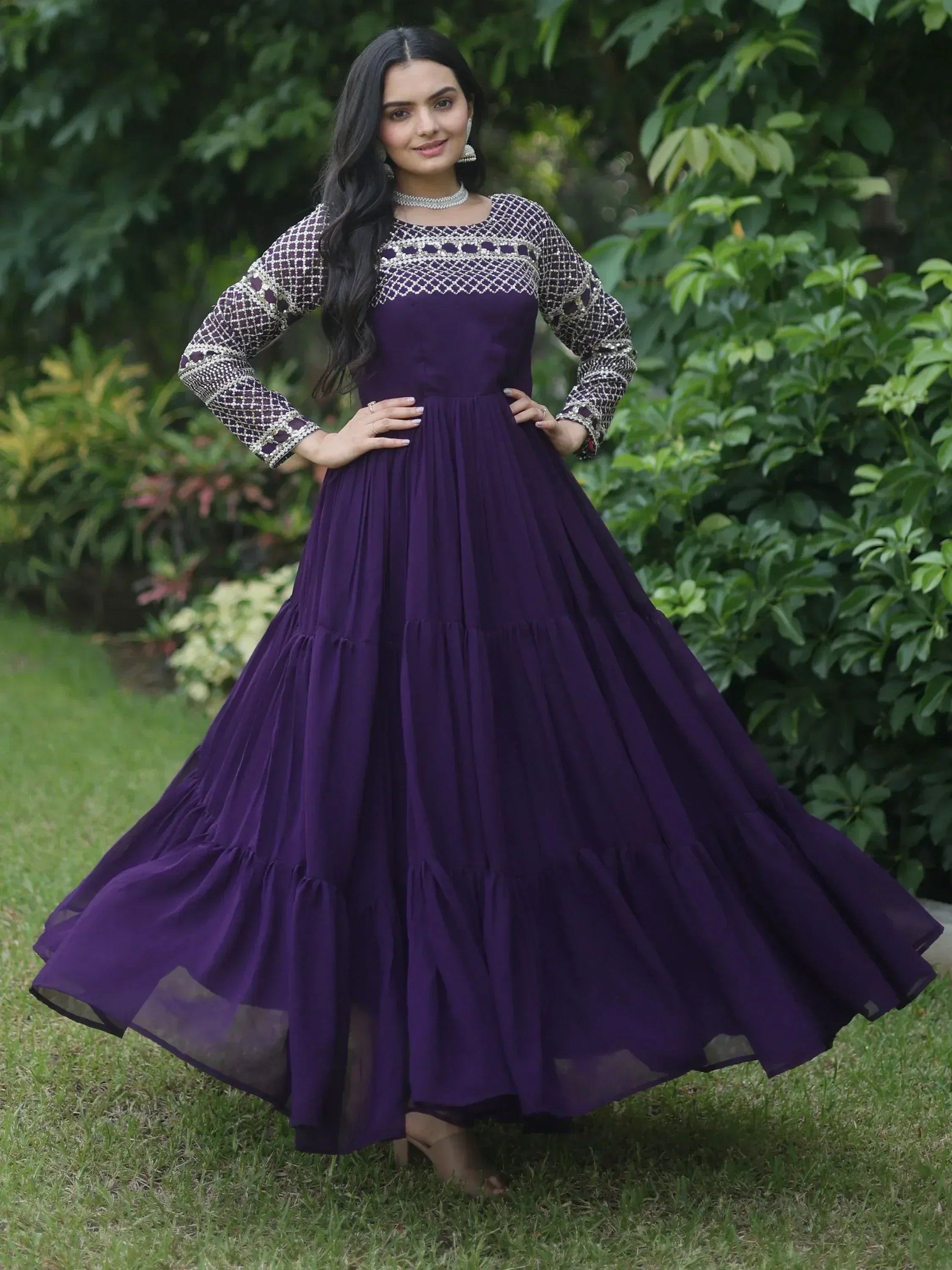 Purple ethnic gown with embroidered sleeves and tiered skirt, perfect for Indian festive occasions
