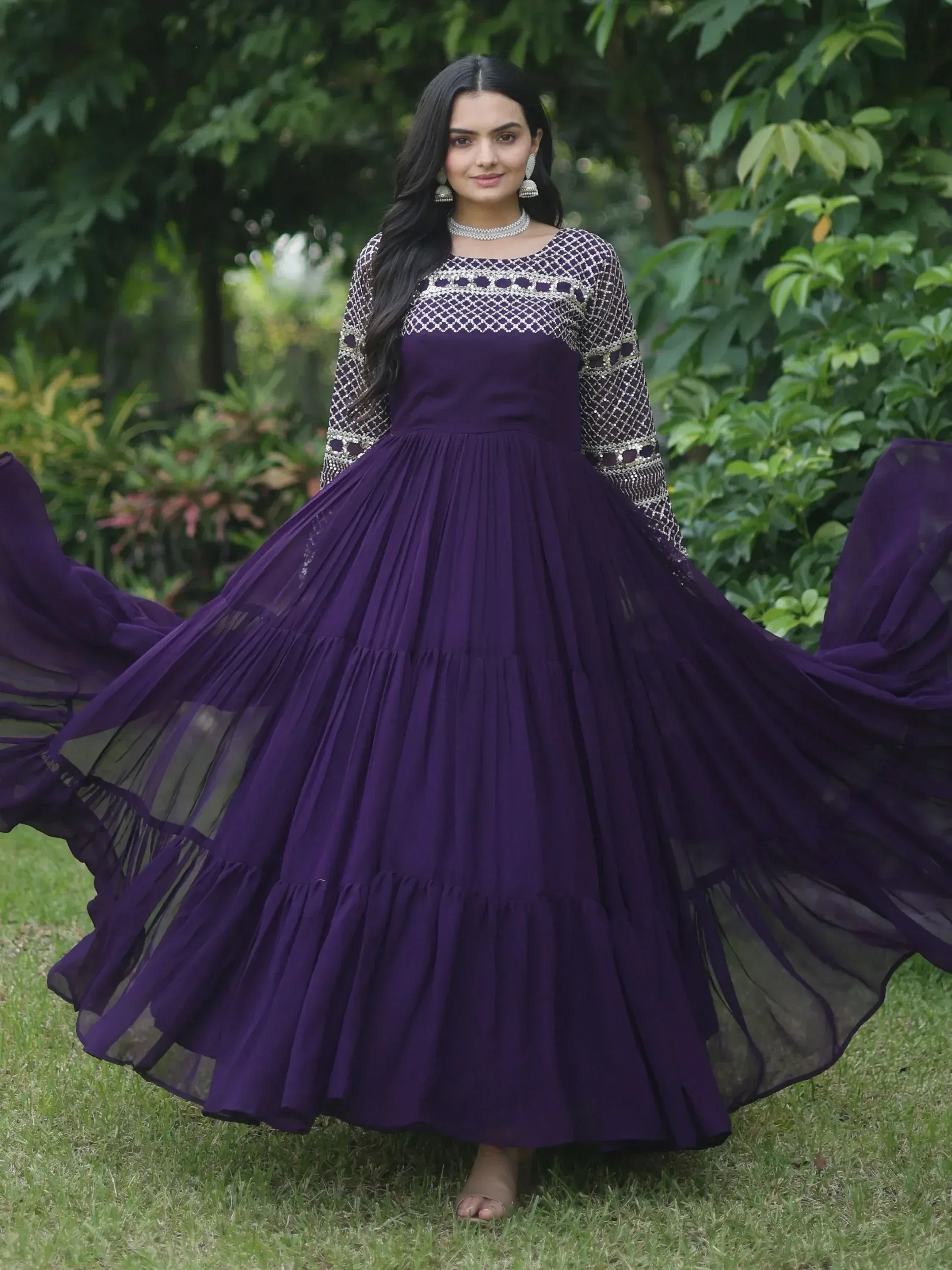 Purple ethnic gown with embroidered sleeves and pleated skirt, perfect for Indian festive occasions