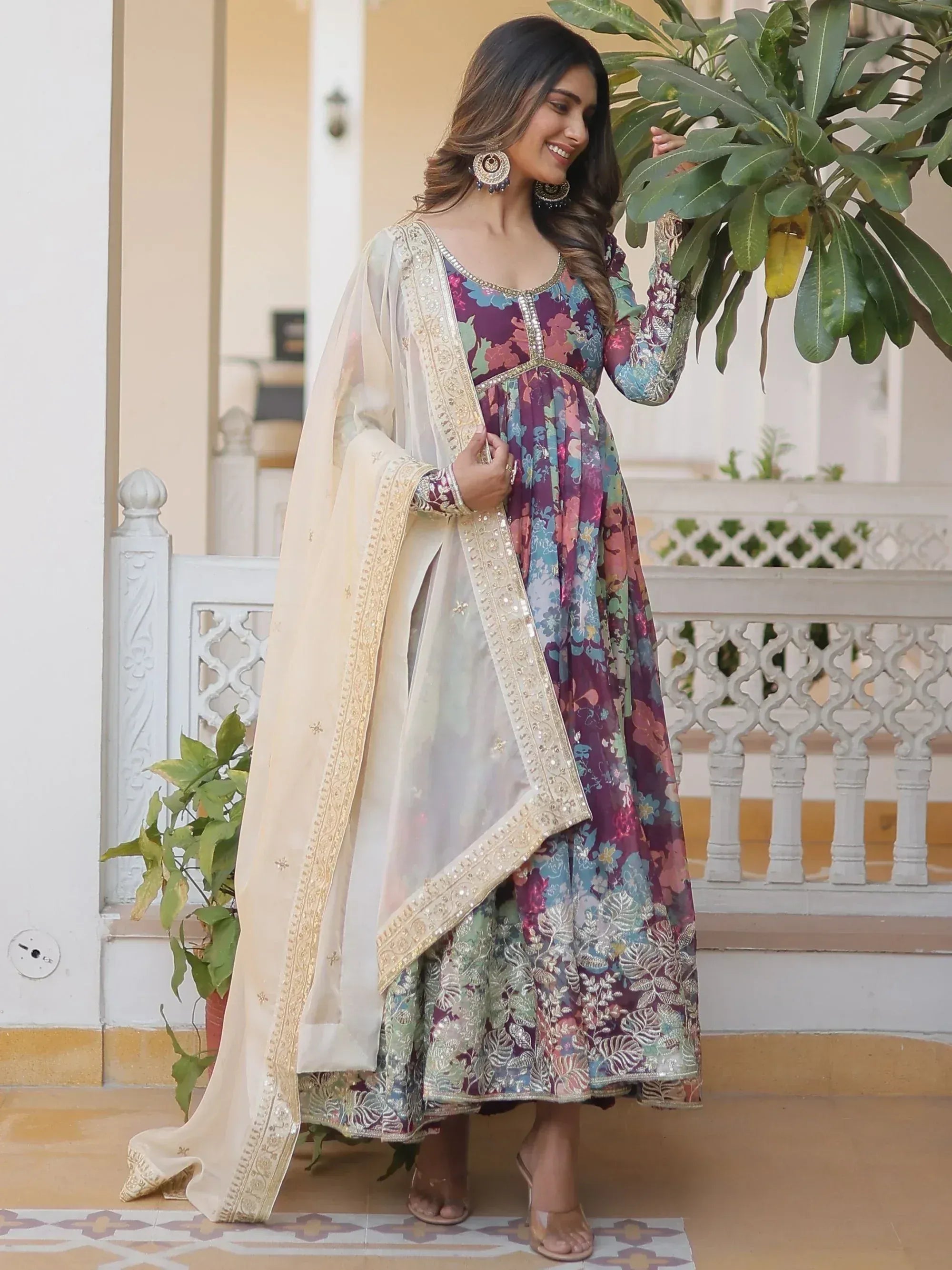 Woman in floral print Indian anarkali with embroidered dupatta, perfect for ethnic occasions