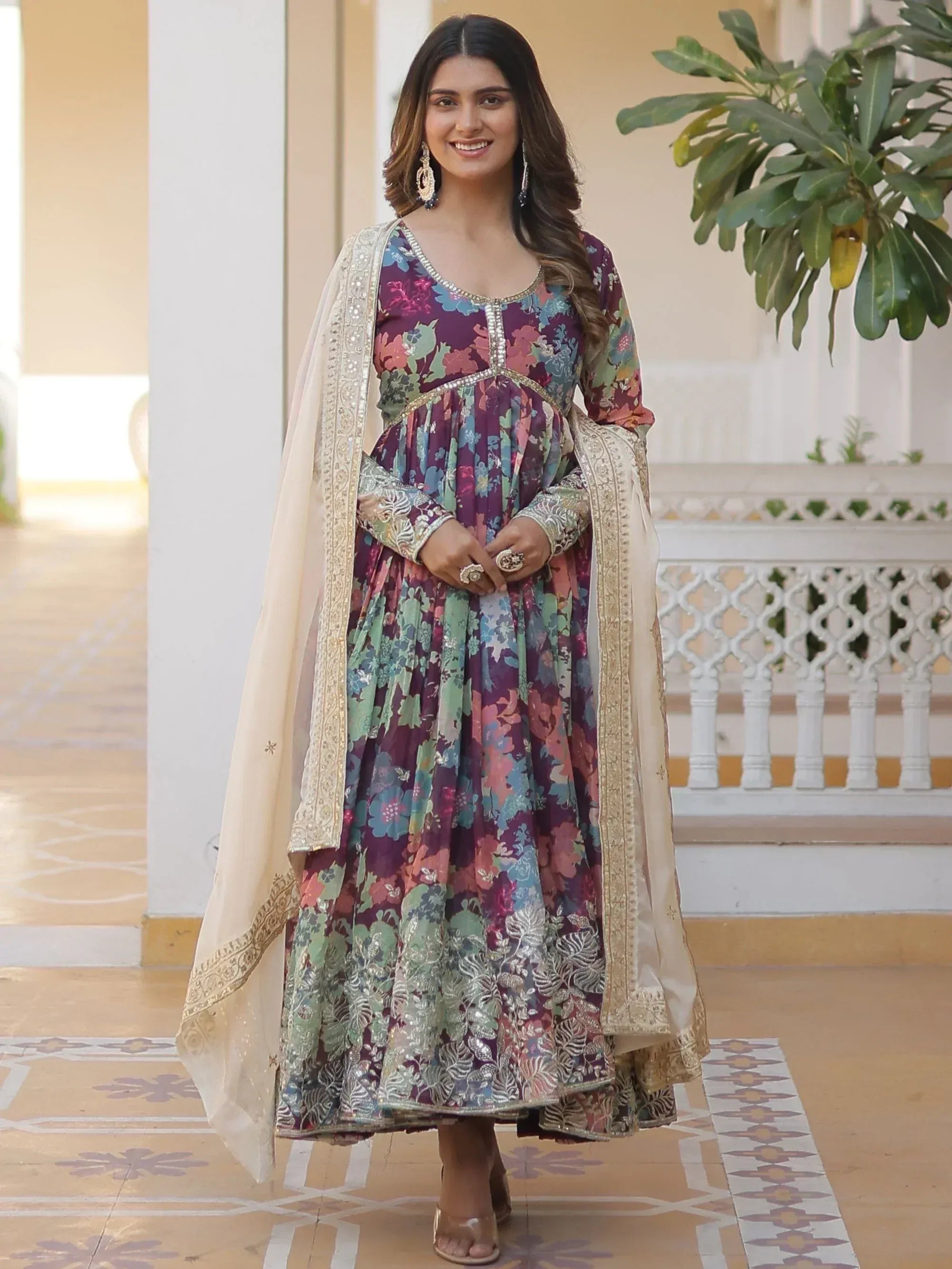 Floral printed ethnic gown with gold embroidery and dupatta, perfect for Indian occasions