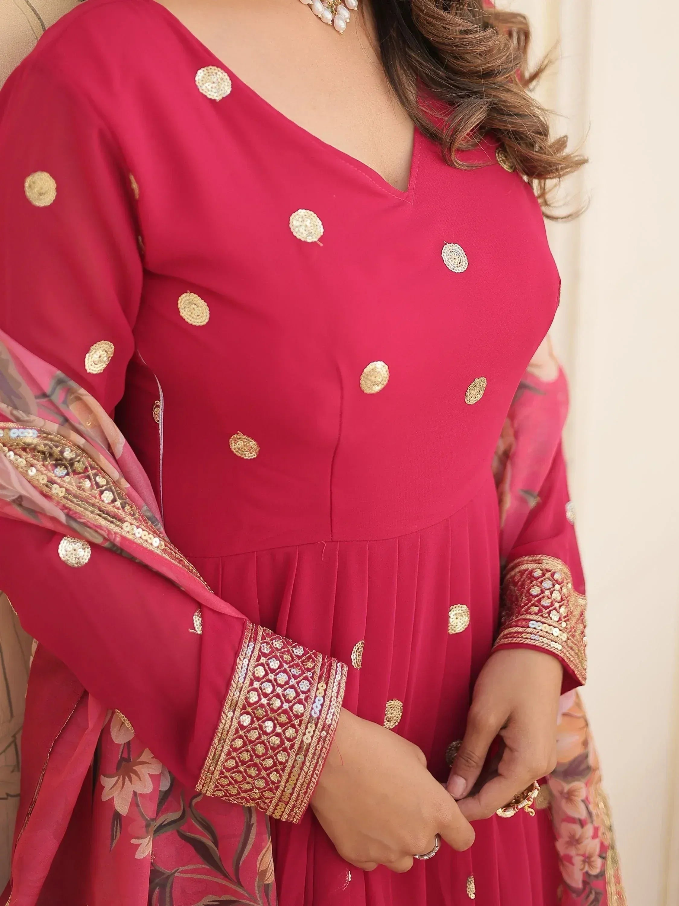 Pink ethnic gown with gold embroidery and floral dupatta, perfect for Indian occasions