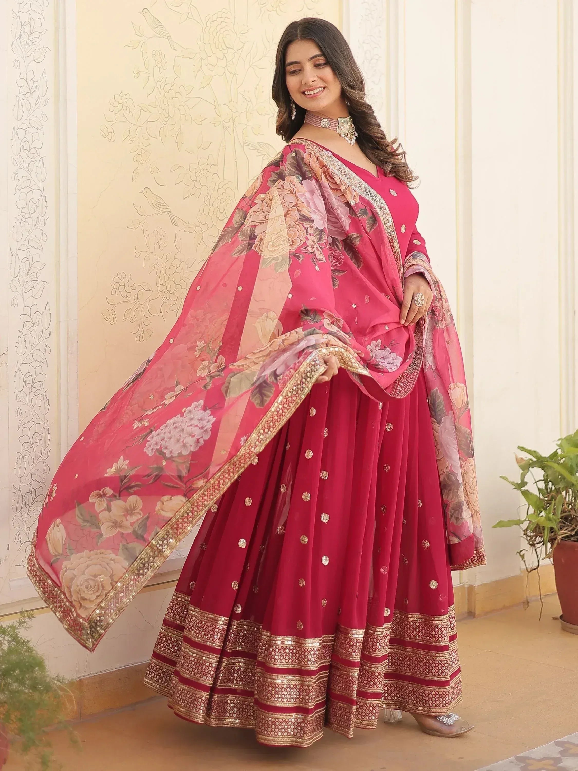 Pink floral printed Indian lehenga choli with gold embroidery and dupatta for festive occasions