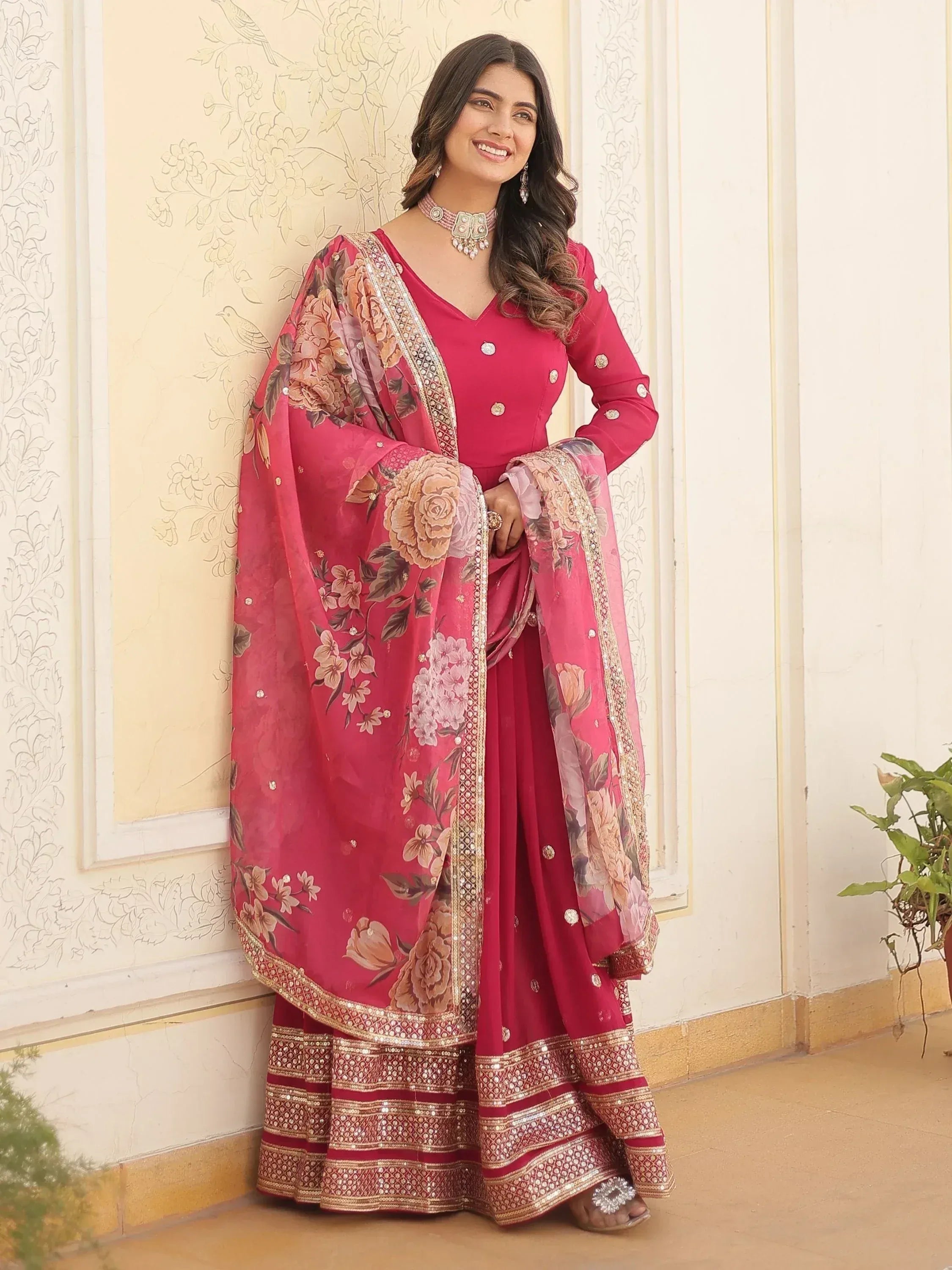 Pink floral printed ethnic salwar kameez with gold embroidery and dupatta, perfect for festive occasions